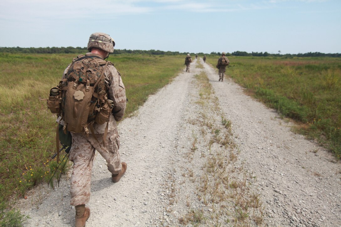 Marines with Bravo Company, 1st Battalion, 2nd Marine Regiment, 2nd Marine Division, conduct a mile-long squad patrol during a field exercise here, Aug. 11. The training was part of a week-long operation to prepare Marines and Sailors for their upcoming deployment with the 24th Marine Expeditionary Unit.