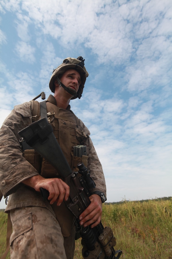 Lance Cpl. Teller James, a rifleman with Bravo Company, 1st Battalion, 2nd Marine Regiment, 2nd Marine Division, conducts a mile-long squad patrol during a field exercise here, Aug. 11. The training was part of a week-long operation to prepare Marines and Sailors for their upcoming deployment with the 24th Marine Expeditionary Unit.