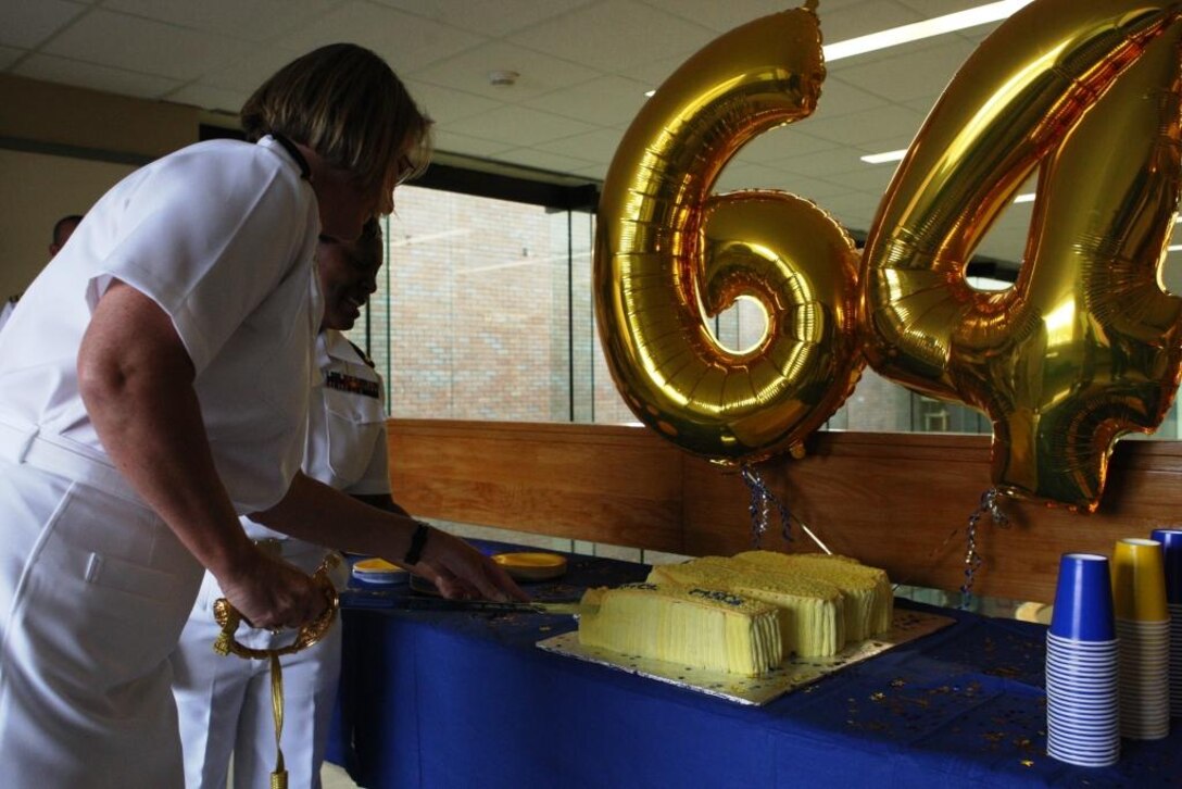 Navy Capt. Debra Soyk, director of Clinical Support Services with Naval Hospital Camp Lejeune, cuts the birthday cake of the Medical Service Corps insignia at NHCL during the MSC 64th birthday celebration, Aug. 12. Later that day, a birthday ball was held at the Paradise Point Officers' Club aboard Marine Corps Base Camp Lejeune, celebrating the 64 years of MSC administration and sciences.