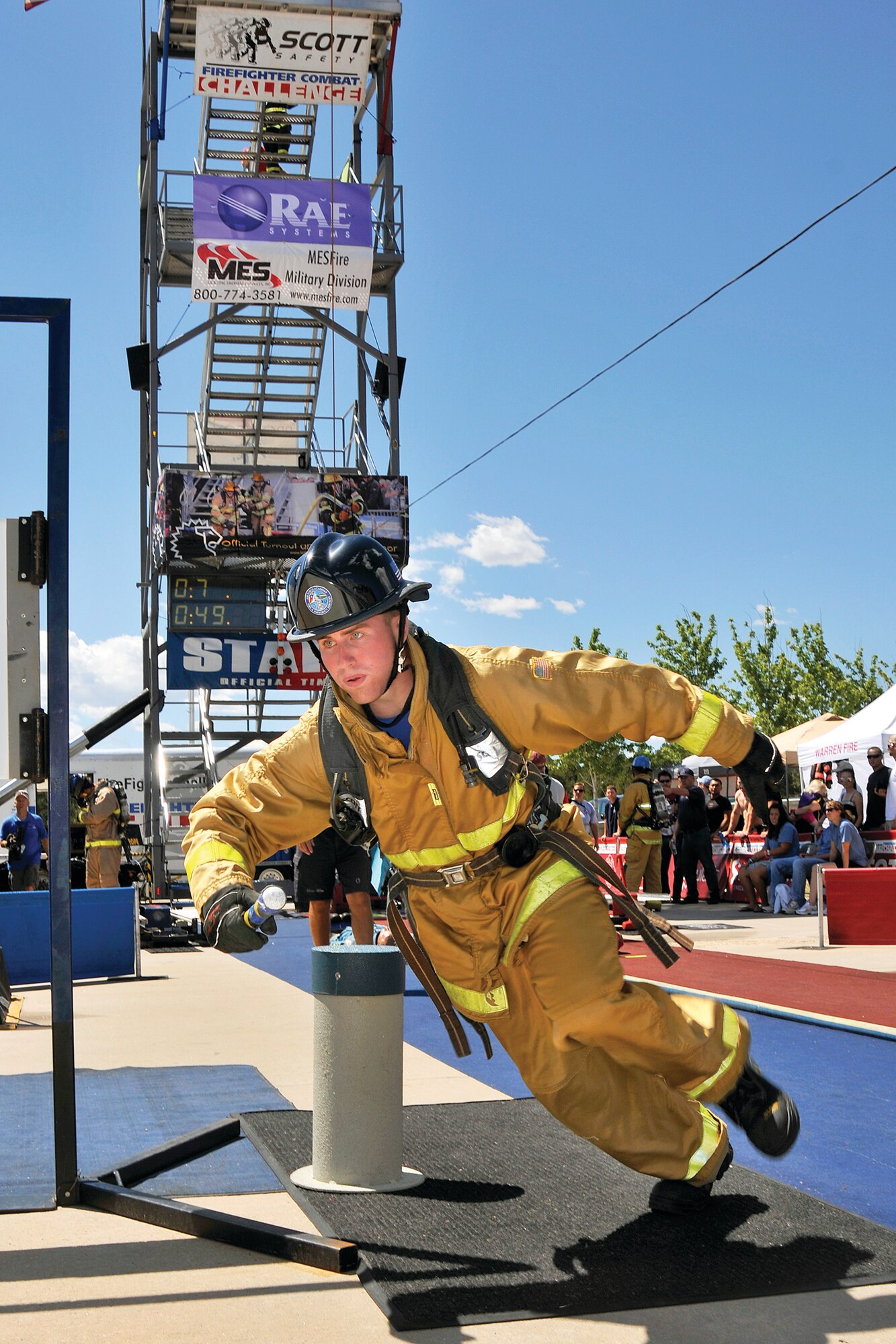 Air Force Academy Firefighter Airman Travis Oster participates in the relay race during Firefighter Challenge Aug. 6 at the Academy.  (U.S. Air Force Photo/Raymond McCoy