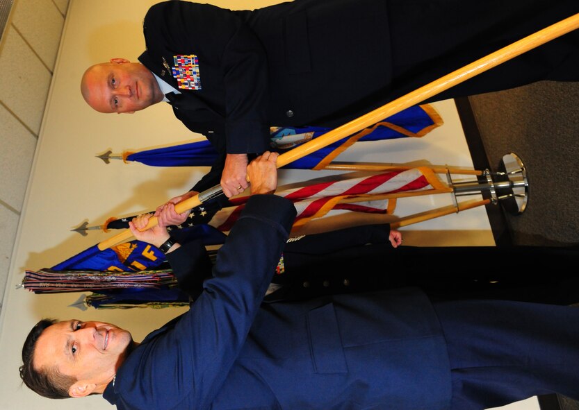 Lt. Col. Robert Buchanan accepts the ceremonial flag for the 301st Fighter
Squadron during a change of command ceremony here August 7. Lt. Col. Scott
Crogg, 44th Fighter Group commander, presided. (U.S. Air Force Photo by SrA Martha Whipple, 44th Fighter Group Public Affairs)