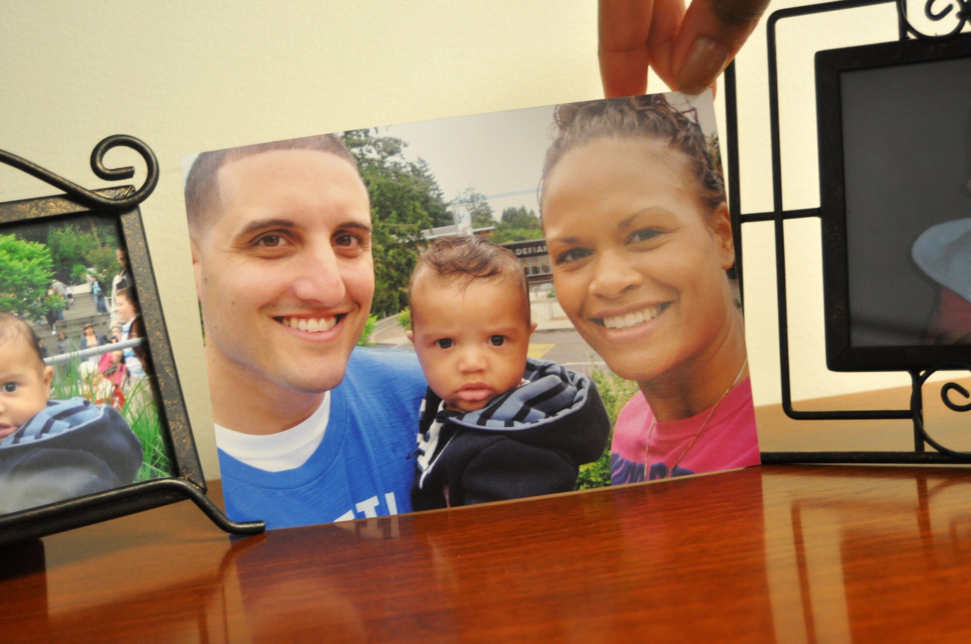 Miriam Howard, right, with husband, Jean-Pierre, and son, Jalen, says it’s important to stay active during and after a pregnancy. The Howard family promotes the Air Force’s Comprehensive Airmen Fitness program by creating a more unified, healthy, self-confident, content and prepared Air Force unit. (U.S. Air Force photo/Airman 1st Class Leah Young)
