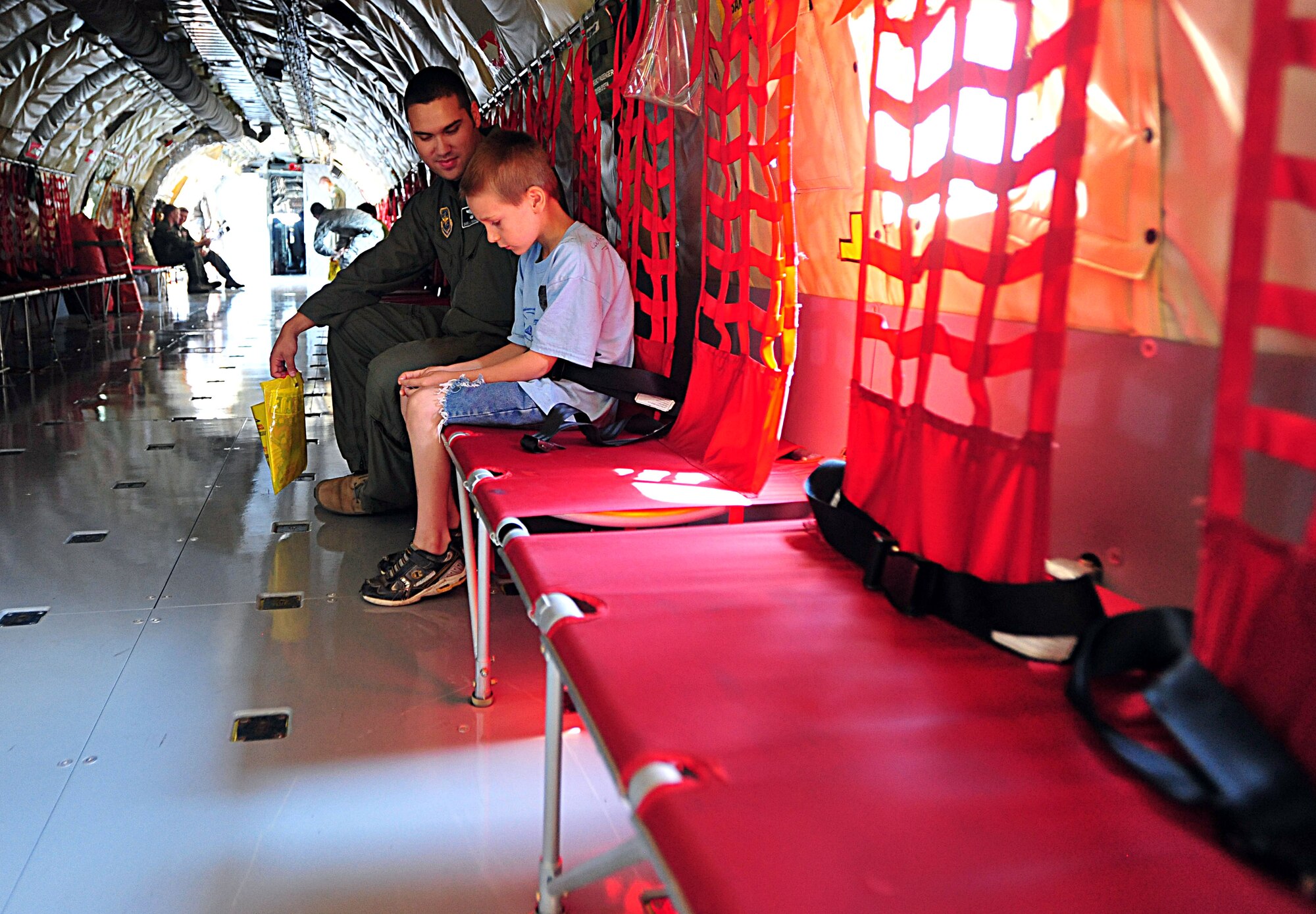 First Lt. David Puchalla, 349th Air Refueling Squadron pilot, explains to Bob, 8, the mission of the KC-135 Stratotanker during the “Big for a Day” program Aug.12, 2011, at McConnell Air Force Base, Kan.  The 349th ARS sponsored the event to help children from Big Brothers Big Sisters understand what Airmen do on a daily basis.  (U.S. Air Force photo/ Senior Airman Courtney Witt)