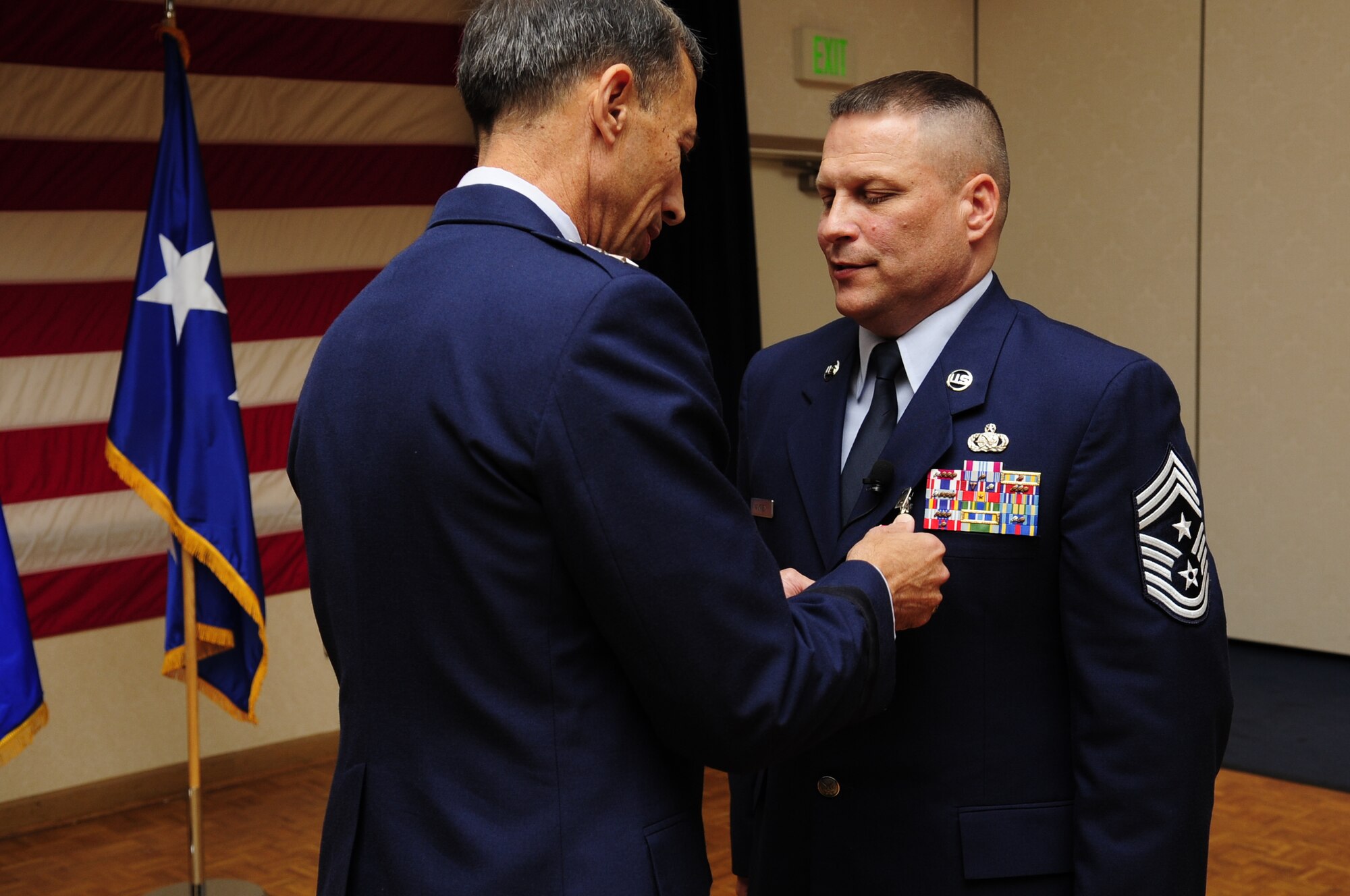 VANDENBERG AIR FORCE BASE, Calif. – Lt. Gen. Larry James, the Deputy Chief of Staff for Intelligence, Surveillance and Reconnaissance, Headquarters U.S. Air Force, Washington, D.C., retires Chief Master Sgt. James A. MacKinley, the 14th Air Force former command chief, during a retirement ceremony at the Pacific Coast Club here Friday, Aug. 12, 2011. Chief MacKinley ends his military career after 30 years of service. (U.S. Air Force photo/Senior Airman Lael Huss)