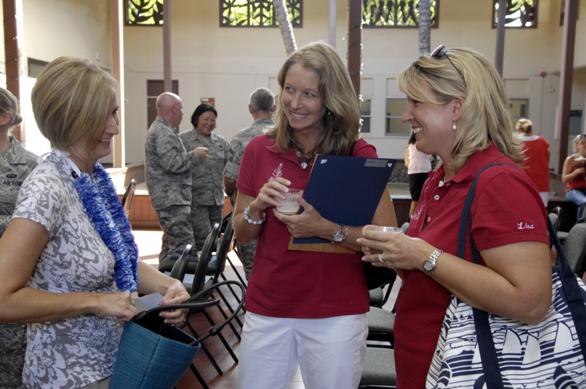Barbara Southworth (center) and Lisa Bednar (right) talk with Mrs. Sherilyn Carlson, wife of Col Dann Carlson, Commander, 647th Air Base Group and Deputy Commander, Joint Base Pearl Harbor-Hickam, Hawaii, during the 1st Annual JBPHH Volunteer Appreciation Ceremony on Aug. 5.  Barbara and Lisa are members of the Wet Hens Sailing Club which was selected for Volunteer Community Non-Profit Agency of the Year. (U.S. Air Force photo/ David D. Underwood, Jr.)