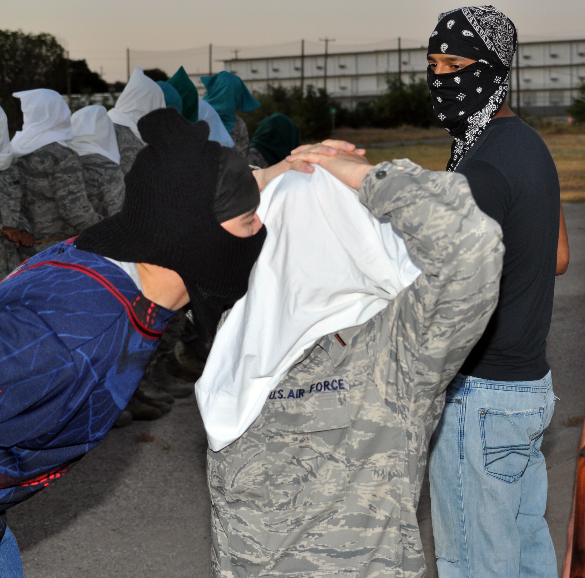 Chaplain candidates are exposed to the type of treatment hostages could receive during a  simulated terrorist attack staged by 610th Security Forces Squadron personnel, from NAS Fort Worth JRB.  The training is intended to give the candidates a better understanding of what members of the armed forces could face in the field. (U.S. Air Force photo/Staff Sgt Chris Bolen)