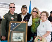 Col. Mark Weatherington, 28th Bomb Wing commander, and his wife, Stephanie (second from right) stand with honored veteran, Salvador “Chuck” Valades and his wife, Darlene in Sturgis, S.D., Aug. 9, 2011. Valades was honored during a special military appreciation event at the conclusion of the 2011 Dakota Thunder Motorcycle Run. (U.S. Air Force photo/Airman Alystria Maurer/Released)