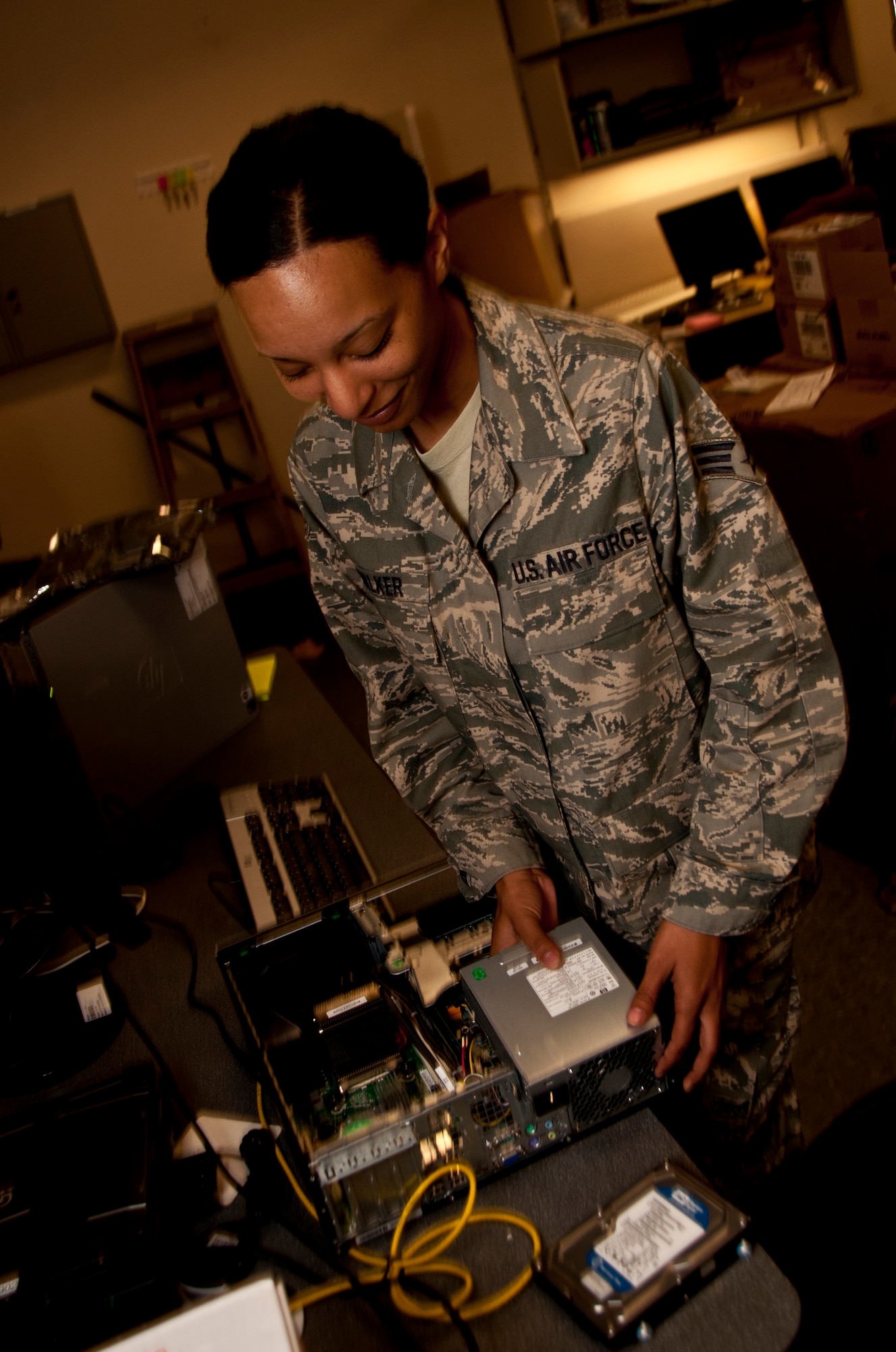Senior Airman Jamie Walker, Knowledge Operations Manager, replaces a computer hard drive at the Charles C. Carson Center for Mortuary Affairs Aug. 11, 2011. Walker was recently recognized as the Headquarters U.S. Air Force, Deputy Chief of Staff for Manpower, Personnel and Services, Airman of the Quarter. (U.S. Air Force photo/ Staff Sgt. Agustin G. Salazar)