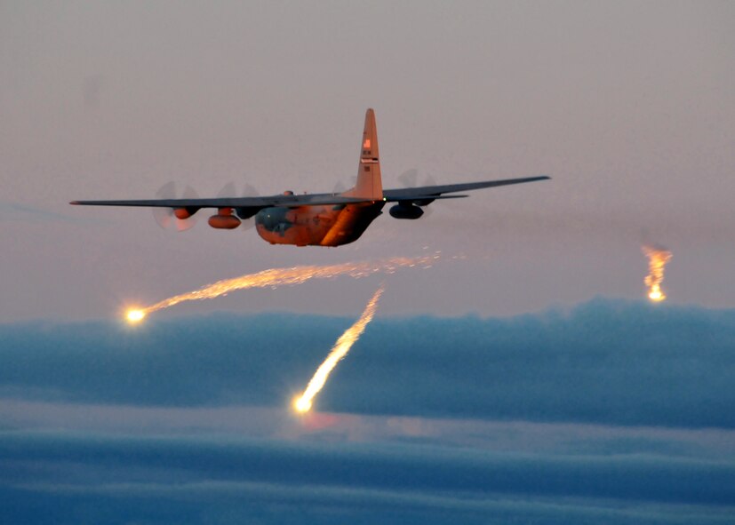 A C-130 from the Niagara Falls Air Reserve Station launches flares over Lake Ontario during a training exercise August 10, 2011, Niagara Falls, NY. Flares can be launched from an aircraft as a defensive measure against hostile forces. (U.S. Air Force photo by Staff Sgt. Joseph McKee)  