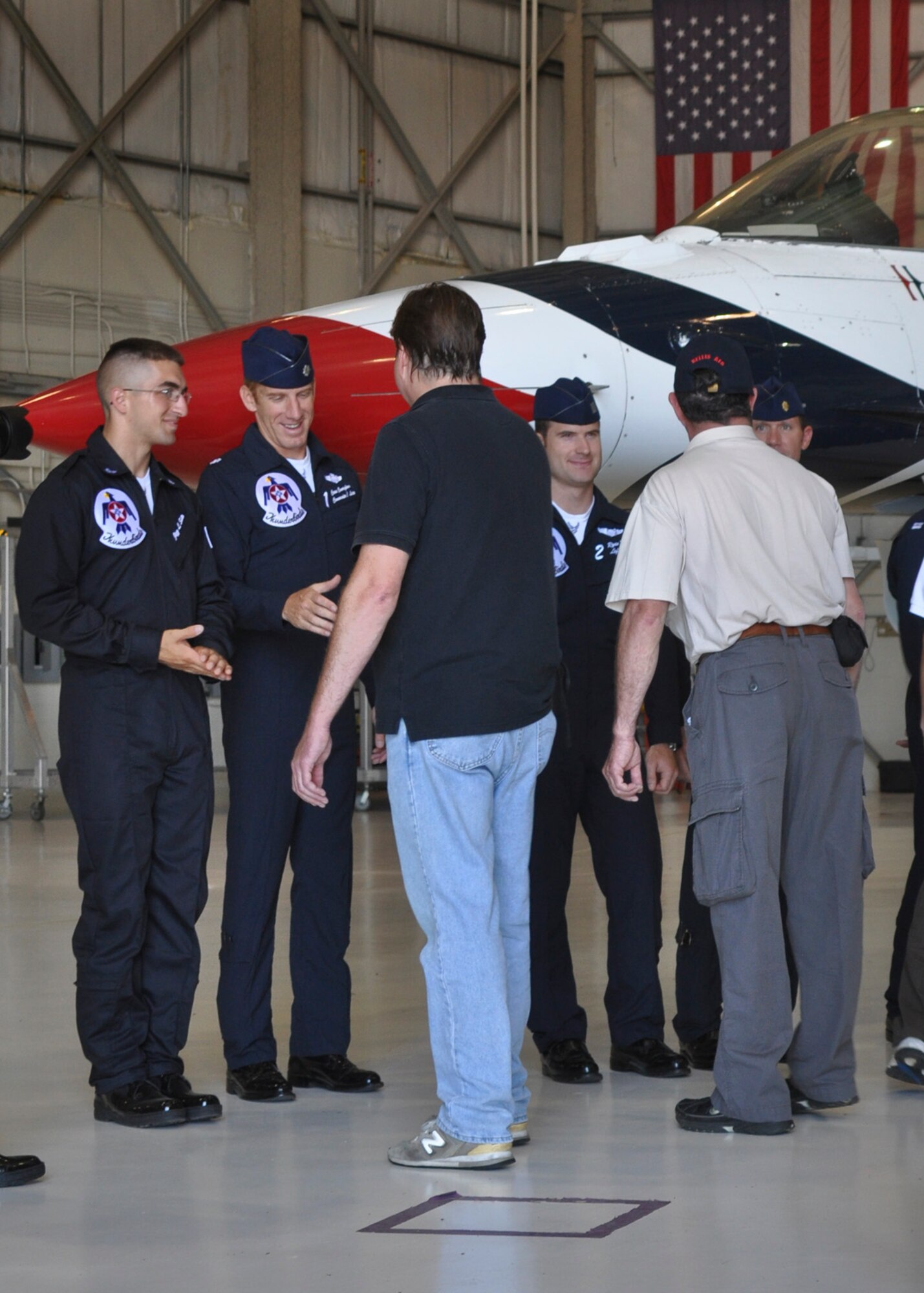 Staff Sgt. Jazz Sutto and Lt. Col. Case Cunningham, Commander (Left) of the Air Force Thunderbirds greet family and friends during a Thunderbird FARKLE ceremony held at the 128th Air Refueling Wing, Milwaukee Wisconsin 7 August, 2011. FARKLE ceremonies, or Family and Relatives, Kinfolk, Loved-ones, and Everyone else, are the Thunderbirds' way of showing their support for fellow team members when an air show takes place in that member's home state. US Air Force photo by: SSgt Jeremy Wilson