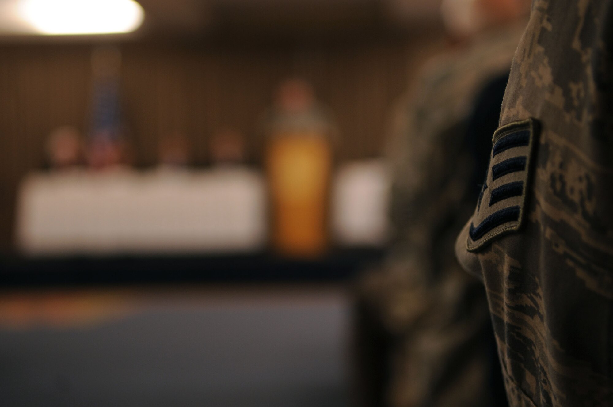 An Air Force staff sergeant listens as a member speaks during a conference that marked the beginning of the Interstate Compact on Educational Opportunity for Military Families on Grand Forks Air Force Base Aug 12. This compact eases the transition for children in military families that go from school to school as a result of military mission requirements. (U.S. Air Force photo by Senior Airman Amanda N. Stencil)