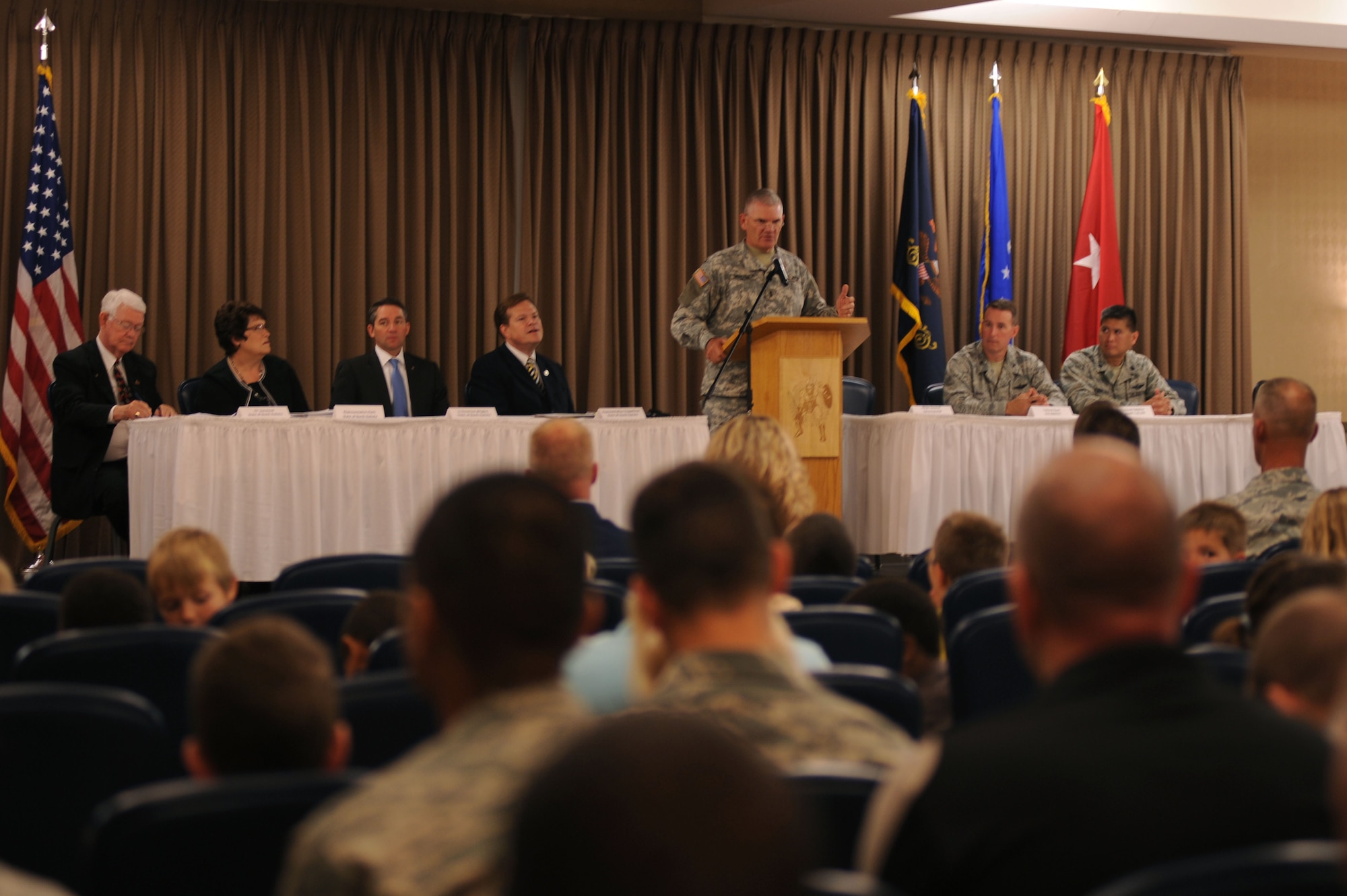 Maj. Gen. David Sprynczynatyk, North Dakota adjutant general, speaks at a conference that marked the beginning of the Interstate Compact on Educational Opportunity for Military Families on Grand Forks Air Force Base Aug 12. This compact eases the transition for children in military families that go from school to school as a result of military mission requirements. (U.S. Air Force photo by Senior Airman Amanda N. Stencil)