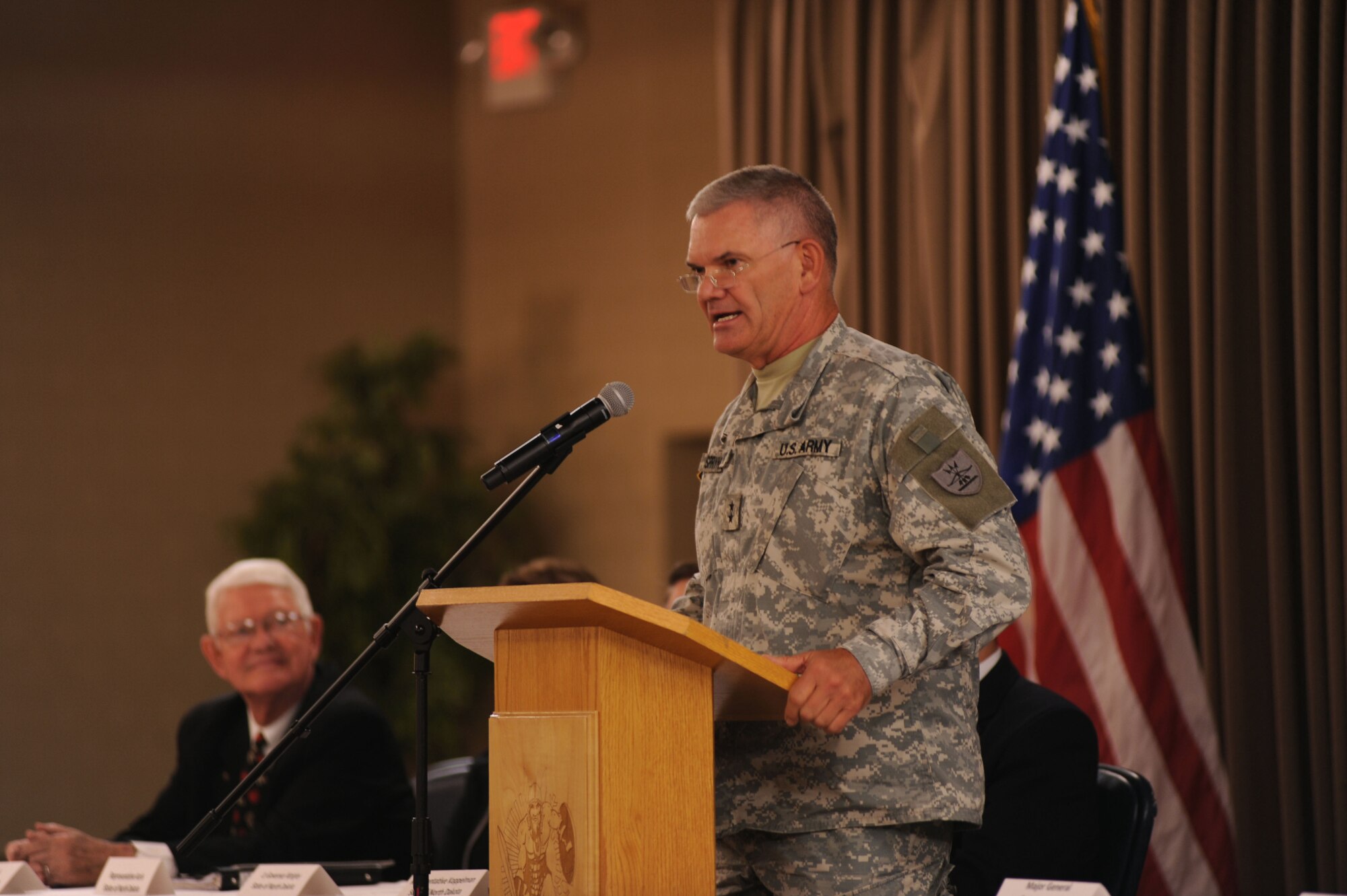 Maj. Gen. David Sprynczynatyk, North Dakota adjutant general, speaks at a conference that marked the beginning of the Interstate Compact on Educational Opportunity for Military Families on Grand Forks Air Force Base Aug 12. This compact eases the transition for children in military families that go from school to school as a result of military mission requirements. (U.S. Air Force photo by Senior Airman Amanda N. Stencil)