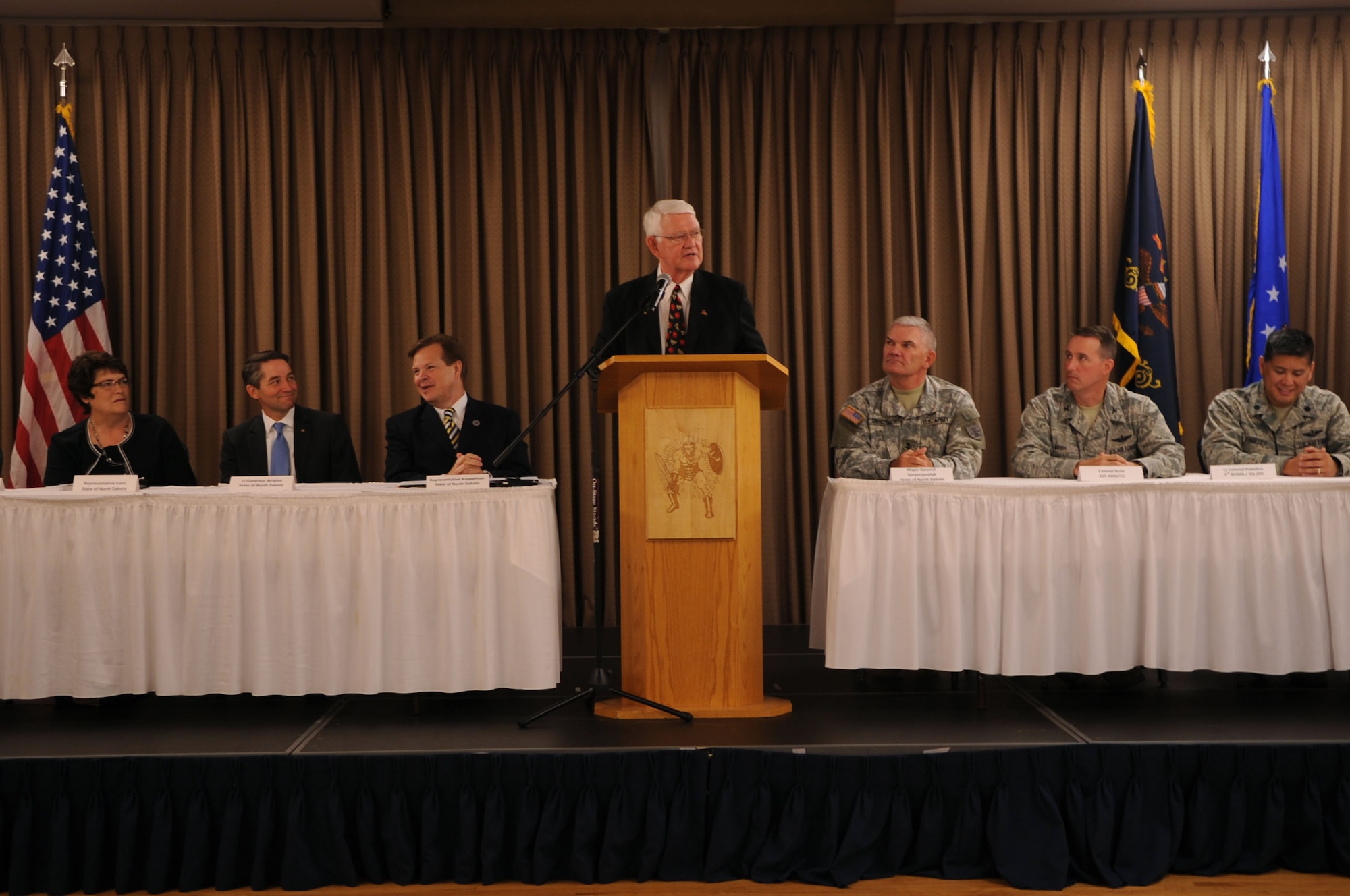Dr. Wayne Sanstead, chair of the Military Education Council, speaks at a conference that marked the beginning of the Interstate Compact on Educational Opportunity for Military Families on Grand Forks Air Force Base Aug 12. This compact eases the transition for children in military families that go from school to school as a result of military mission requirements. (U.S. Air Force photo by Senior Airman Amanda N. Stencil)
