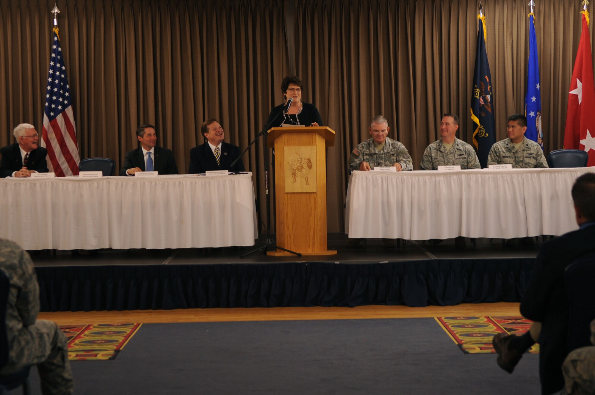 U.S. Rep. Karen Karls of North Dakota speaks at a conference that marked the beginning of the Interstate Compact on Educational Opportunity for Military Families on Grand Forks Air Force Base Aug 12. This compact eases the transition for children in military families that go from school to school as a result of military mission requirements. (U.S. Air Force photo by Senior Airman Amanda N. Stencil)