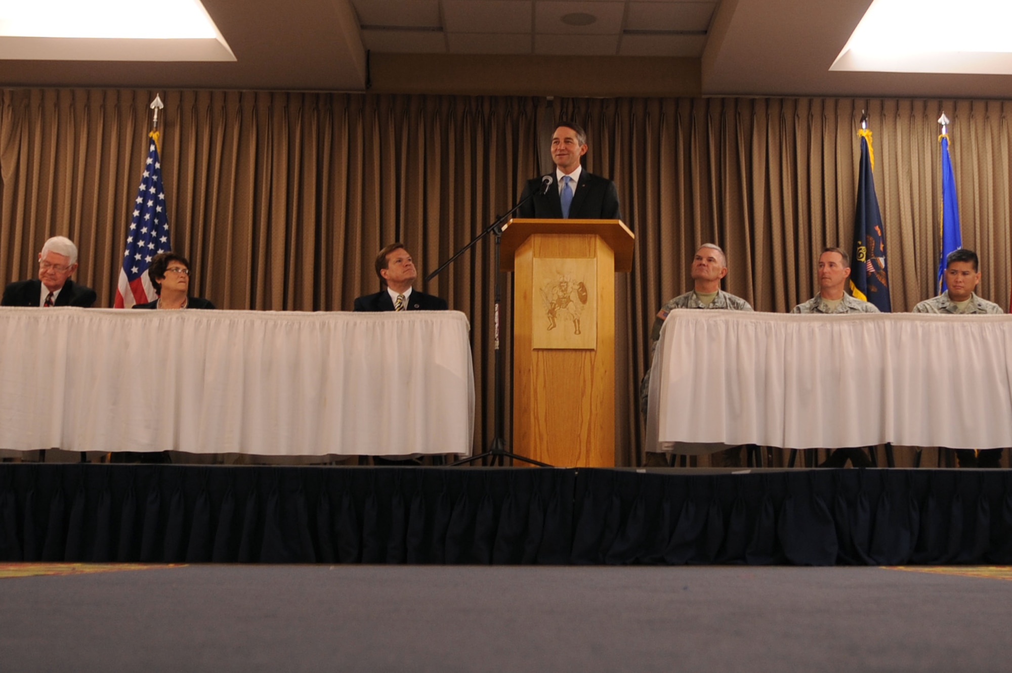 Drew Wrigley, Lt. Governor of North Dakota, speaks at a conference that marked the beginning of the Interstate Compact on Educational Opportunity for Military Families on Grand Forks Air Force Base Aug 12. This compact eases the transition for children in military families that go from school to school as a result of military mission requirements. (U.S. Air Force photo by Senior Airman Amanda N. Stencil)