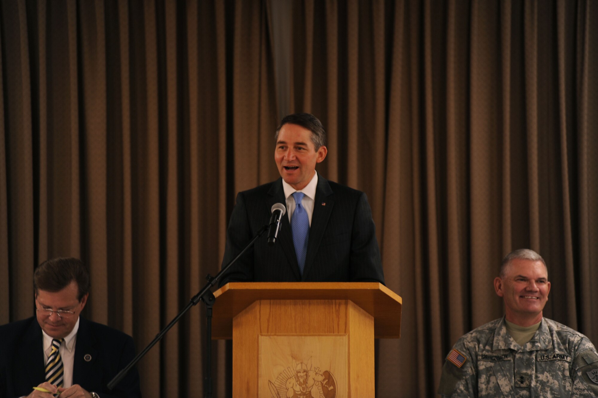 Drew Wrigley, Lt. Governor of North Dakota, speaks at a conference that marked the beginning of the Interstate Compact on Educational Opportunity for Military Families on Grand Forks Air Force Base Aug 12. This compact eases the transition for children in military families that go from school to school as a result of military mission requirements. (U.S. Air Force photo by Senior Airman Amanda N. Stencil)