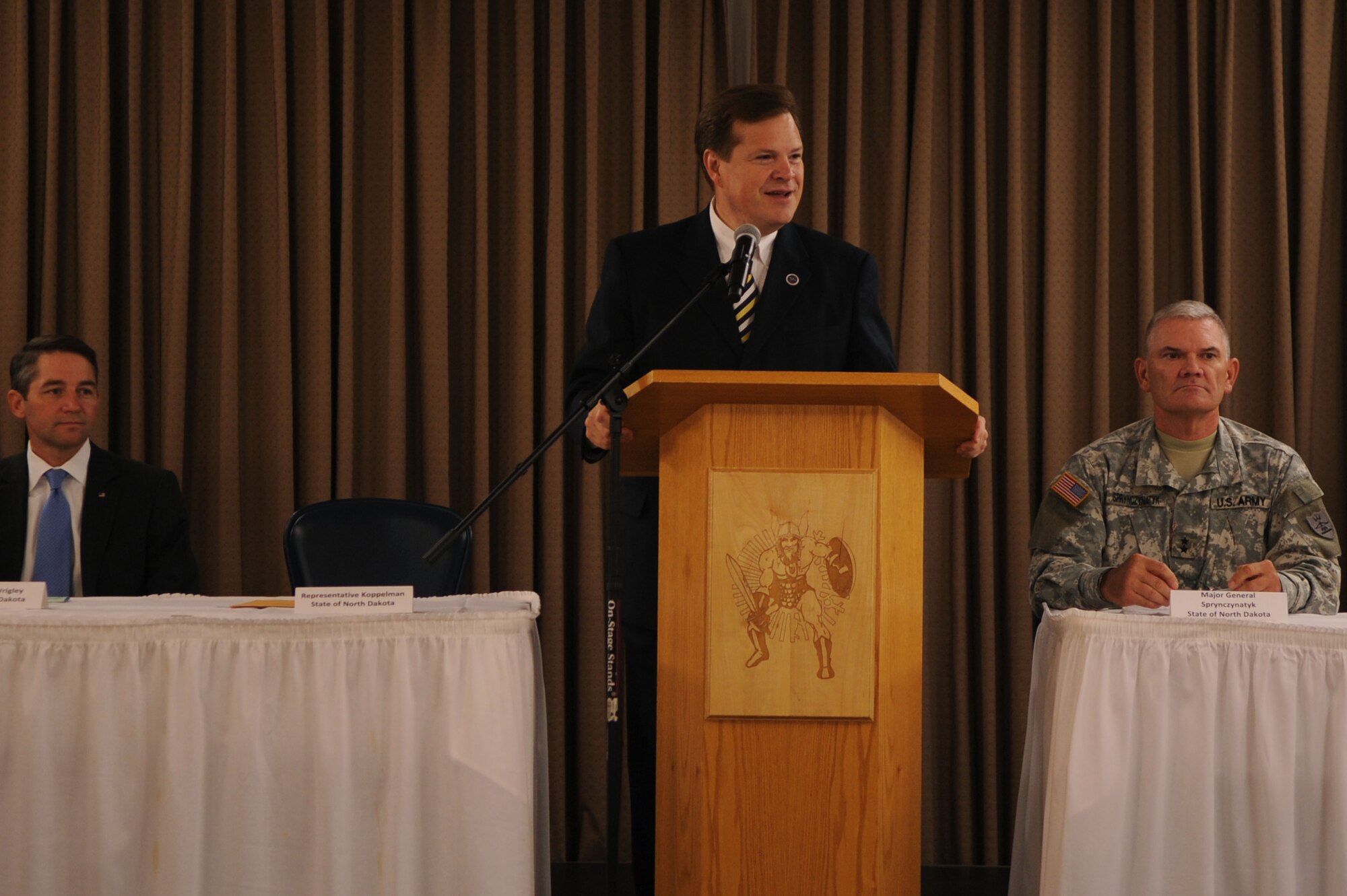 U.S. Rep. Kim Koppelman of North Dakota speaks at a conference that marked the beginning of the Interstate Compact on Educational Opportunity for Military Families on Grand Forks Air Force Base Aug 12. This compact eases the transition for children in military families that go from school to school as a result of military mission requirements. (U.S. Air Force photo by Senior Airman Amanda N. Stencil)