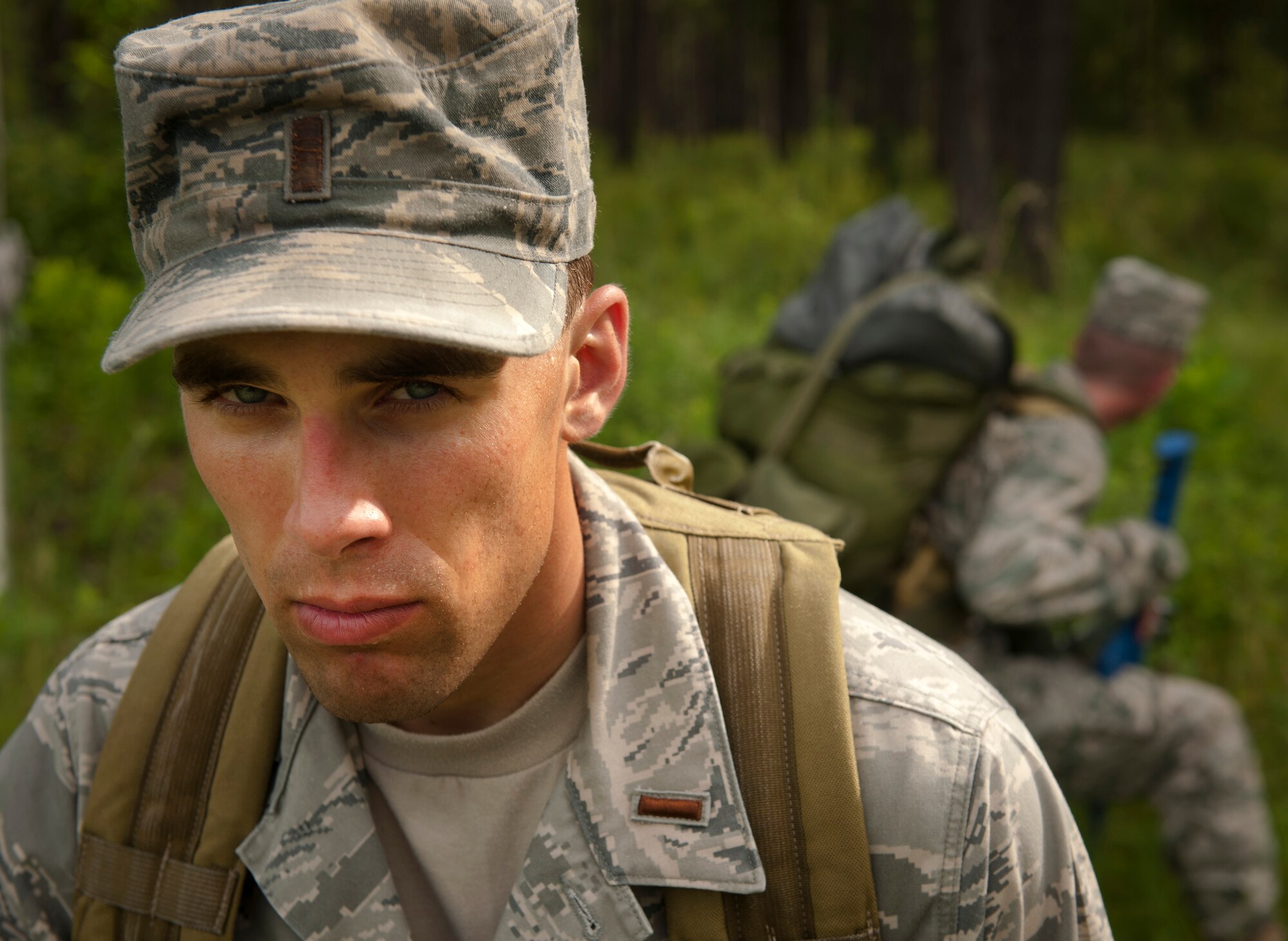 U.S. Air Force 2nd Lt. Nathan Rings, 47th Operations Support Squadron tech pilot student from Laughlin Air Force Base, Texas, keeps watch over his fellow Airmen during a land navigation exercise for the air liaison officer (ALO) training course at Moody Air Force Base, Ga., Aug. 2, 2011. Trainees participated in the ALO training as a preliminary course to the school they’ll attend if recommended by the cadre. (U.S. Air Force photo by Airman 1st Class Joshua Green/Released)
