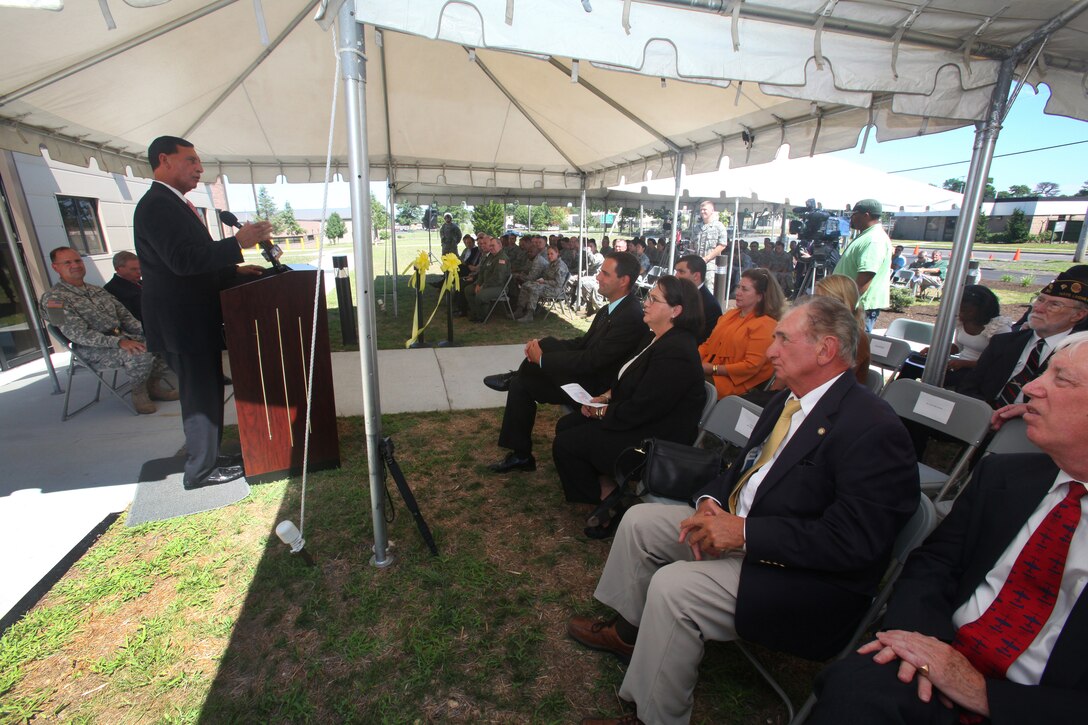 Rep. Frank A. LoBiondo (R.-2nd Dist.) addresses a crowd of more than 100 at a dual ribbon cutting ceremony at the 177th Fighter Wing, New Jersey Air National Guard, on August 11, 2011.  Federal and state officials joined with senior New Jersey National Guard commanders and 177th Fighter Wing Airmen at the ceremony for the Wing’s new Headquarters and 227th Air Support Operations Squadron (ASOS) buildings. The new headquarters provides space for the commander and staff, conference rooms, and a training classroom, while the 227th ASOS facility has offices for flight operations and mission planning, along with maintenance, weapons and other storage areas. The 227th is assigned to provide direct support for the New Jersey Army National Guard’s 50th Brigade Combat Team and Pennsylvania National Guard’s 2/28th Brigade Combat Team. (U.S. Air Force photo by Master Sgt. Mark C. Olsen)