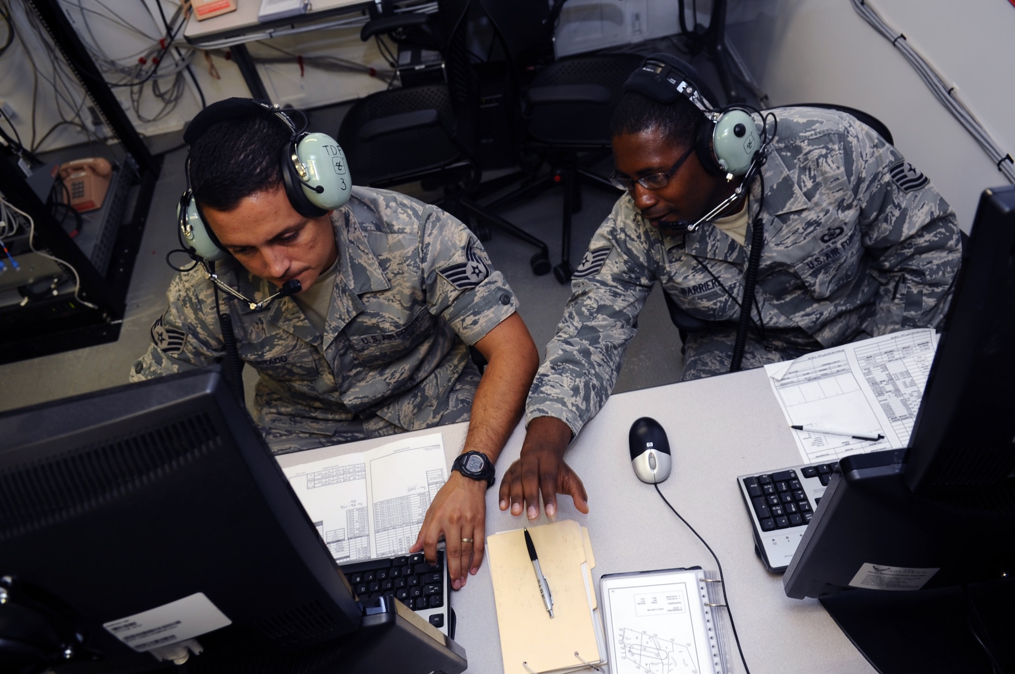 Staff Sgt. Marco Hurtado and Tech. Sgt. Aaron Barriers, 107th Air Control Squadron weapons director instructors, control a live flying mission downrange Aug. 2.  (U.S. Air Force photo by Senior Airman Tracie Forte)