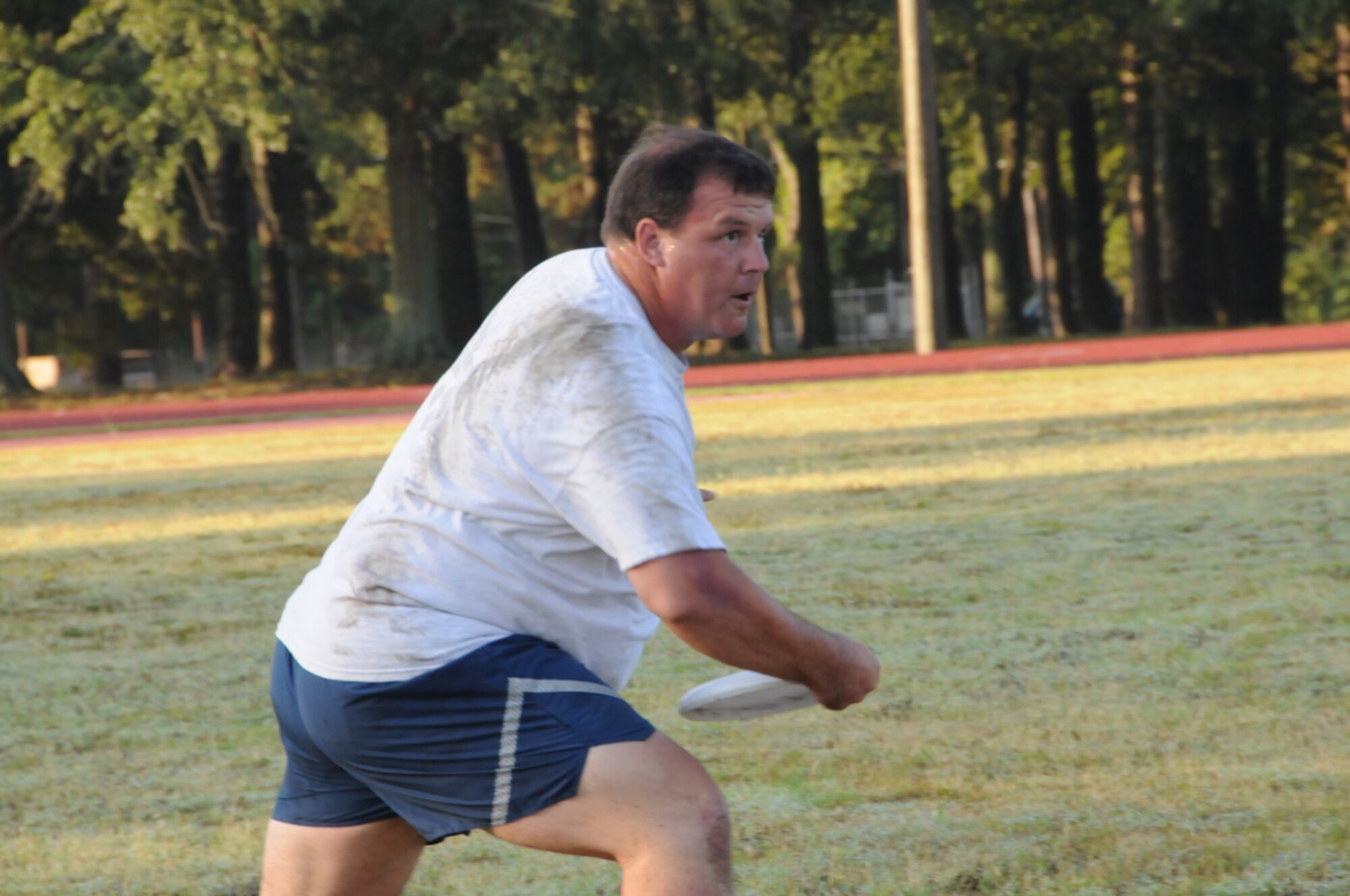 Lt. Col. Greg Potts, 916th Air Refueling Wing plans officer, plays ultimate frisbee in July 2010. Potts struggled with the new fitness test, but is a role model for other Airmen showing that goals are obtainable. (USAF photo by 916ARW/PA)