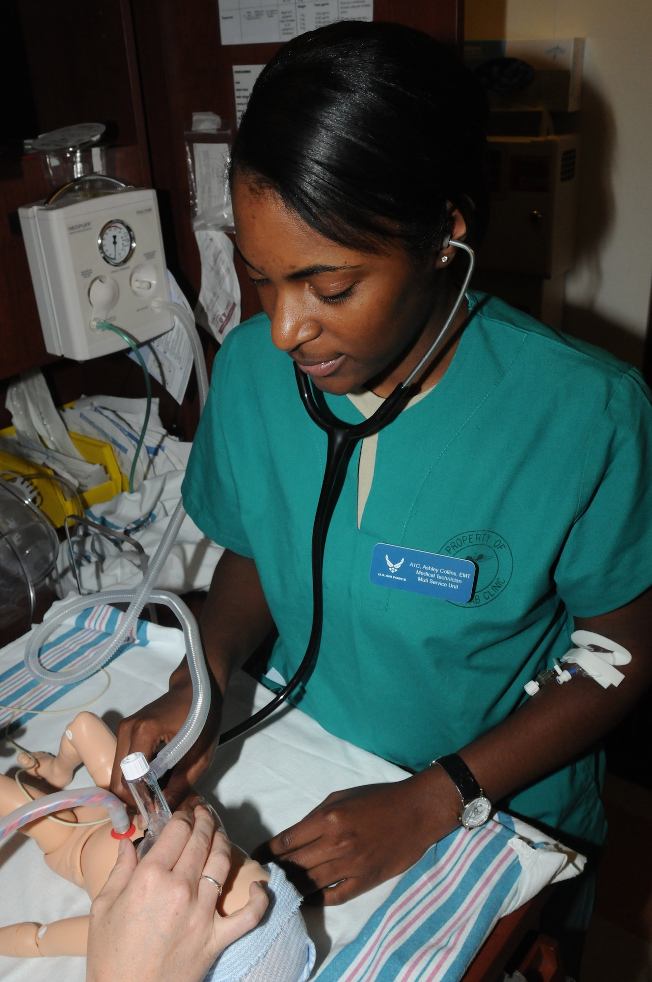 Airman 1st Class Ashley Collins, 31st Surgical Operations Squadron aerospace medical technician, uses a stethoscope on a simulated newborn for a head to toe infant assessment Aug. 8 at the 31st Medical Group hospital at Aviano Air Base, Italy. Collins performs this assessment to ensure infants have properly developed bones and joints.(U.S. Air Force photo/Airman LaVel Sterling)