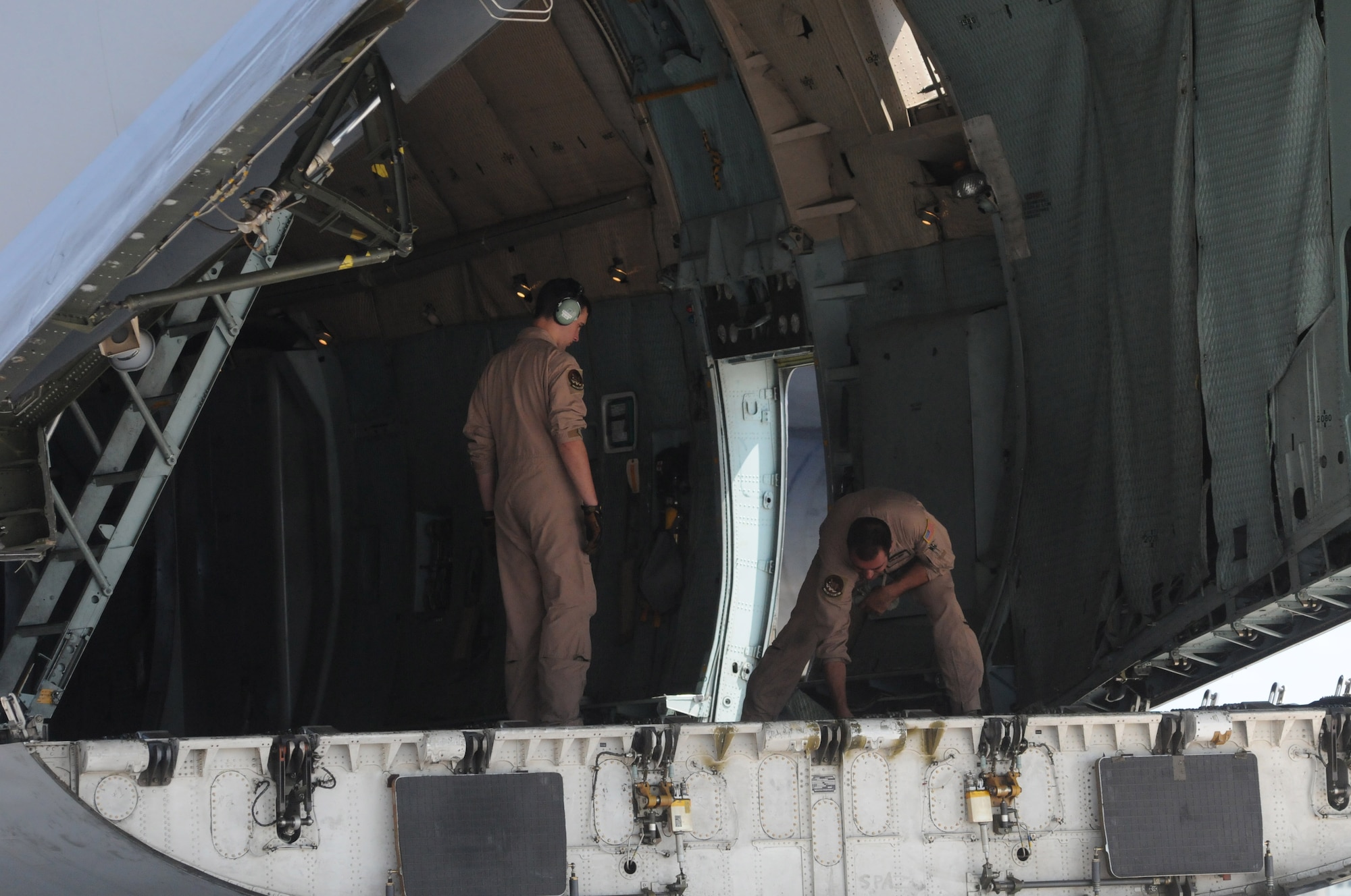 Members of the 22nd Airlift Squadron from Travis Air Force Base, Calif., prepare to load cargo on a C-5 Galaxy Aug. 11 at Aviano Air Base, Italy. The C-5 can hold up to 769,000 pounds of cargo and can travel up to 579 miles per hour.(U.S. Air Force photo/Airman LaVel Sterling)