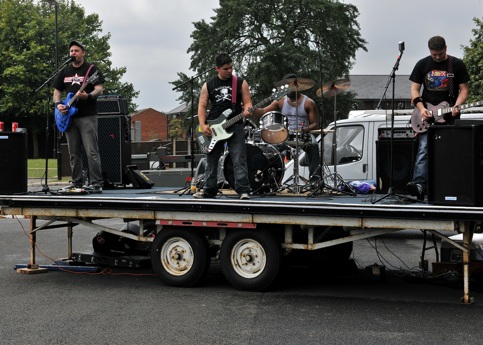 RAF MILDENHALL, England –Last Call Heros play during Unaccompanied Airmen Appreciation Day here Aug. 12, 2011.  Airmen were provided free burgers, beverages and live music courtesy of various base organizations. (U.S. Air Force photo/Staff Sgt. Tabitha M. Lee)