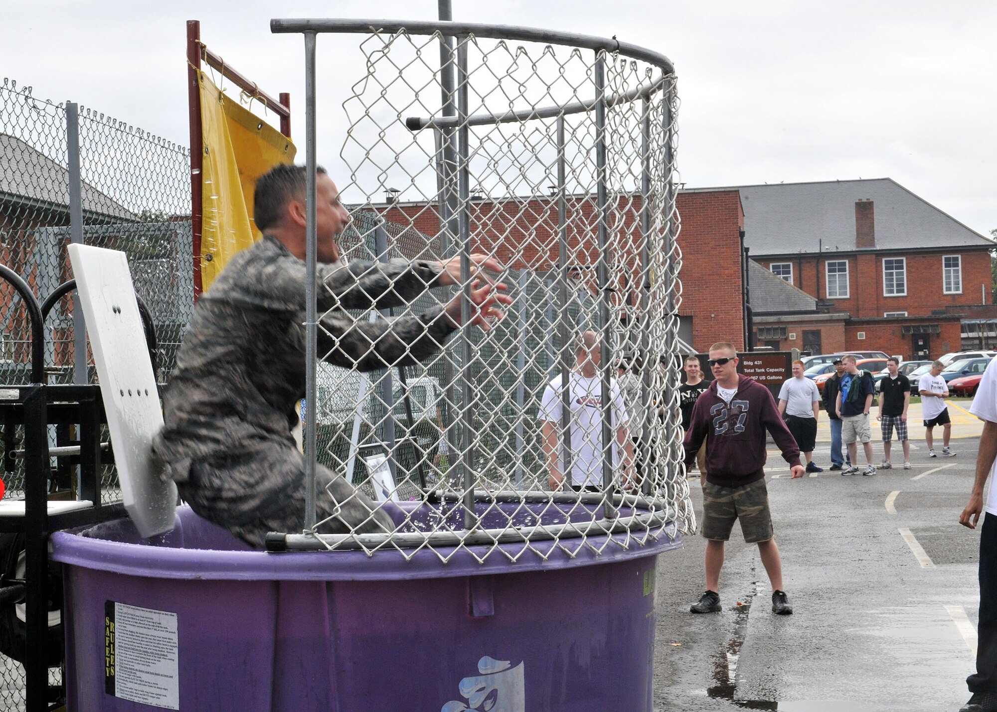 RAF MILDENHALL, England – Lt. Col. Gene Mattingly, 100th Communications Squadron commander, serves time in the dunk tank here Aug. 12, 2011, during the Unaccompanied Airmen Appreciation Day. Airmen were provided free burgers, beverages and live music, courtesy of various base organizations. (U.S. Air Force photo/Staff Sgt. Tabitha M. Lee)