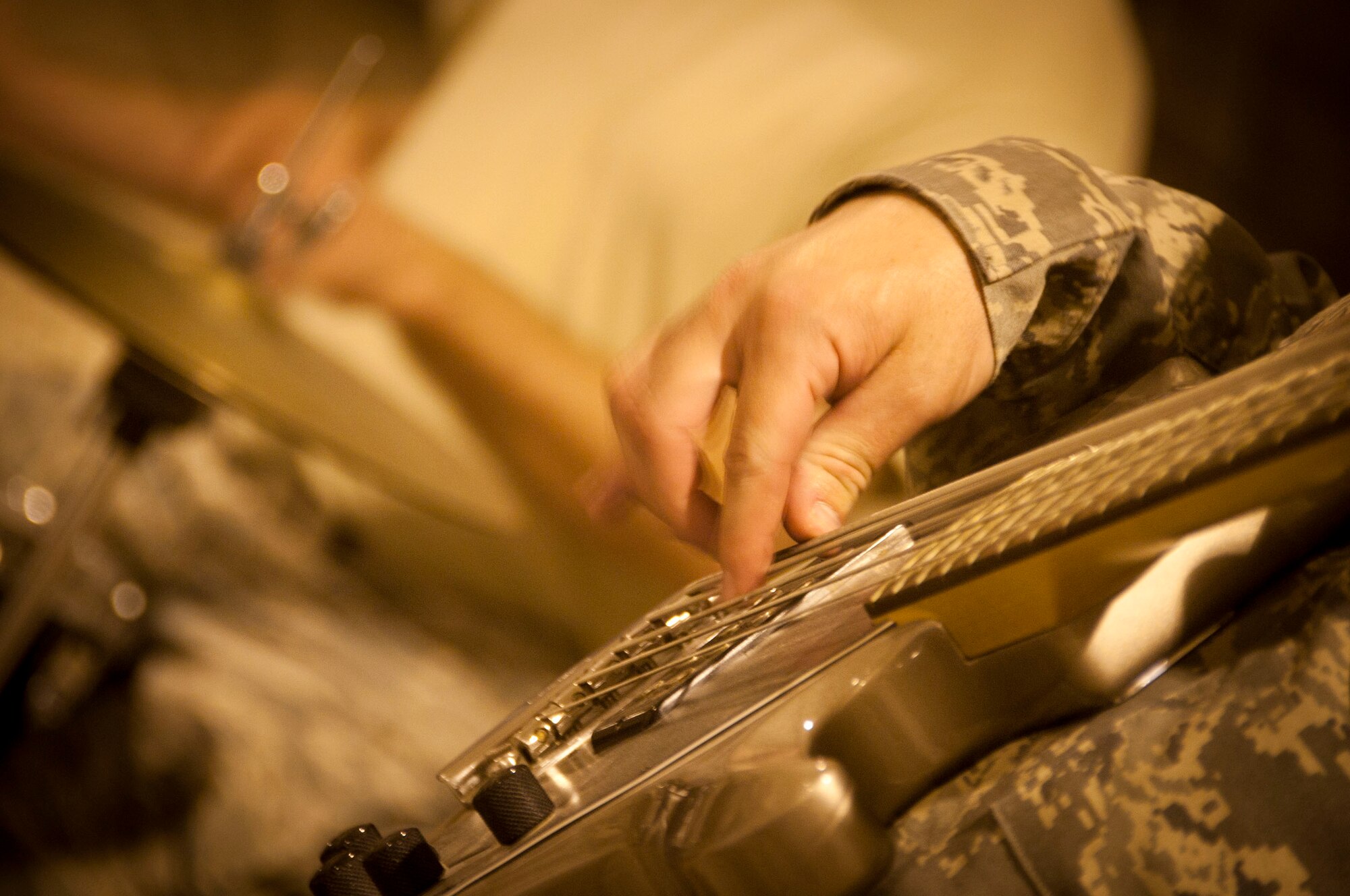 The AFCENT band performs a hit song with participating military members at Shindand Airbase, Afghanistan,Aug. 10, 2011. The band is touring through Afghanistan to different bases to boost morale and entertain troops. (U.S. Air Force photo/Senior Airman Corey Hook)