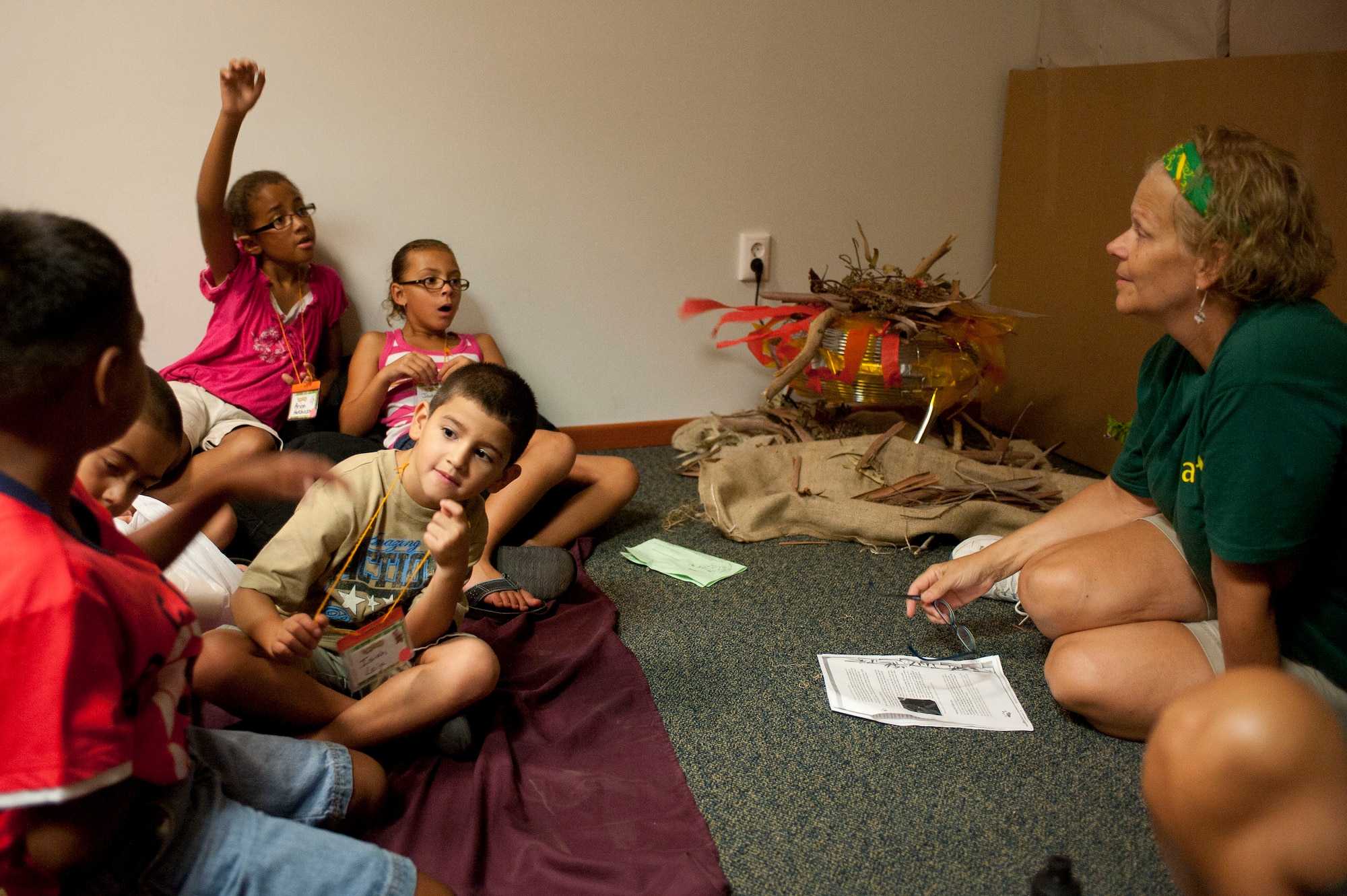 A PandaMania Vacation Bible School volunteer speaks with children about the Bible Aug. 11, 2011, at Incirlik Air Base, Turkey. VBS was held Aug. 8-12 and is an annual event that provides a fun way for children to reinforce their religious teachings. (U.S. Air Force photo by Airman 1st Class Clayton Lenhardt/Released)