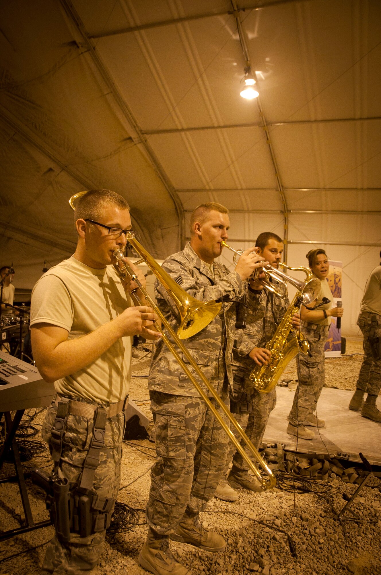 Staff Sergeants Devin Larue, Ransom Miller andToby Callaway perform as the AFCENT band "Sidewinder" for military members at Shindand Airbase, Afghanistan, Aug. 10, 2011. The band plays new and old hits of country, hip hop and rock. (U.S. Air Force photo/Senior Airman Corey Hook)