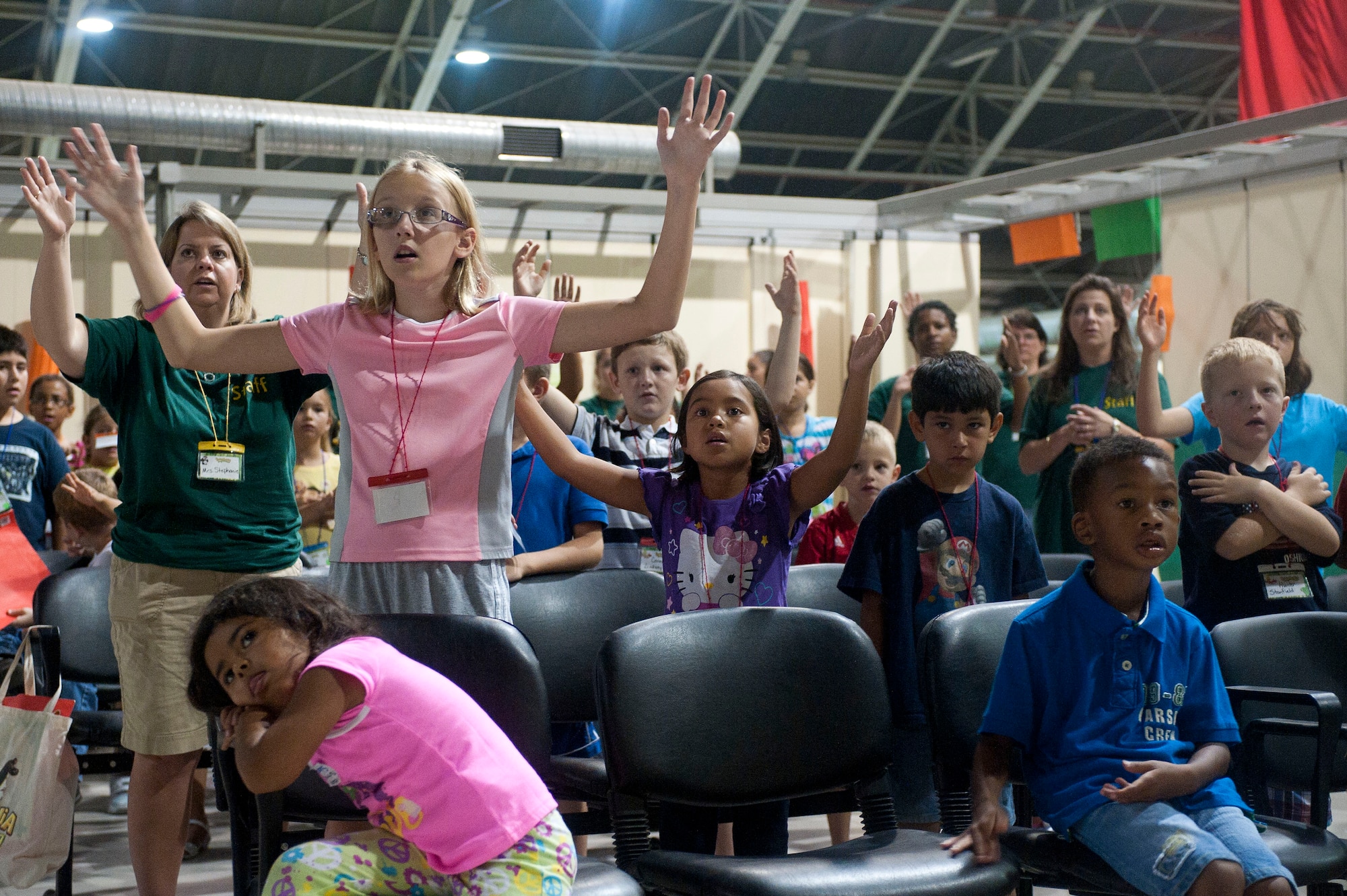 Children and volunteers of PandaMania Vacation Bible School dance and sing along to music Aug. 11, 2011, at Incirlik Air Base, Turkey. VBS was held Aug. 8-12 and is an annual event that provides a fun way for children to reinforce their religious teachings. (U.S. Air Force photo by Airman 1st Class Clayton Lenhardt/Released)