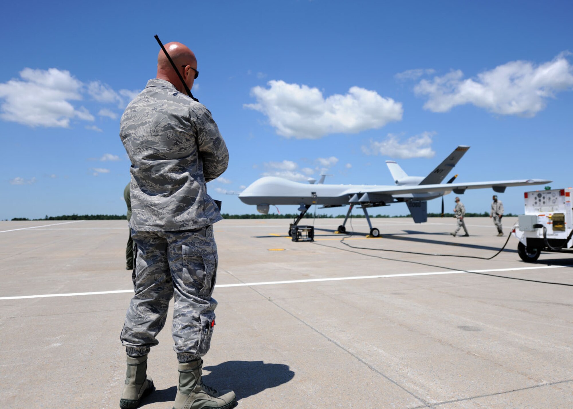 U.S. Air Force Maj. Timothy Martin, 174th Fighter Wing Aircraft Maintenance Squadron commander, oversees members of the ground crew prepare a MQ-9 Reaper for its first taxi movements at Wheeler-Sack Army Air Field in Watertown, NY, on 30 June 2011.  The 174th Fighter Wing is the first Air National Guard unit to operate the MQ-9. (US Air Force photo by Tech. Sgt. Jeremy Call)