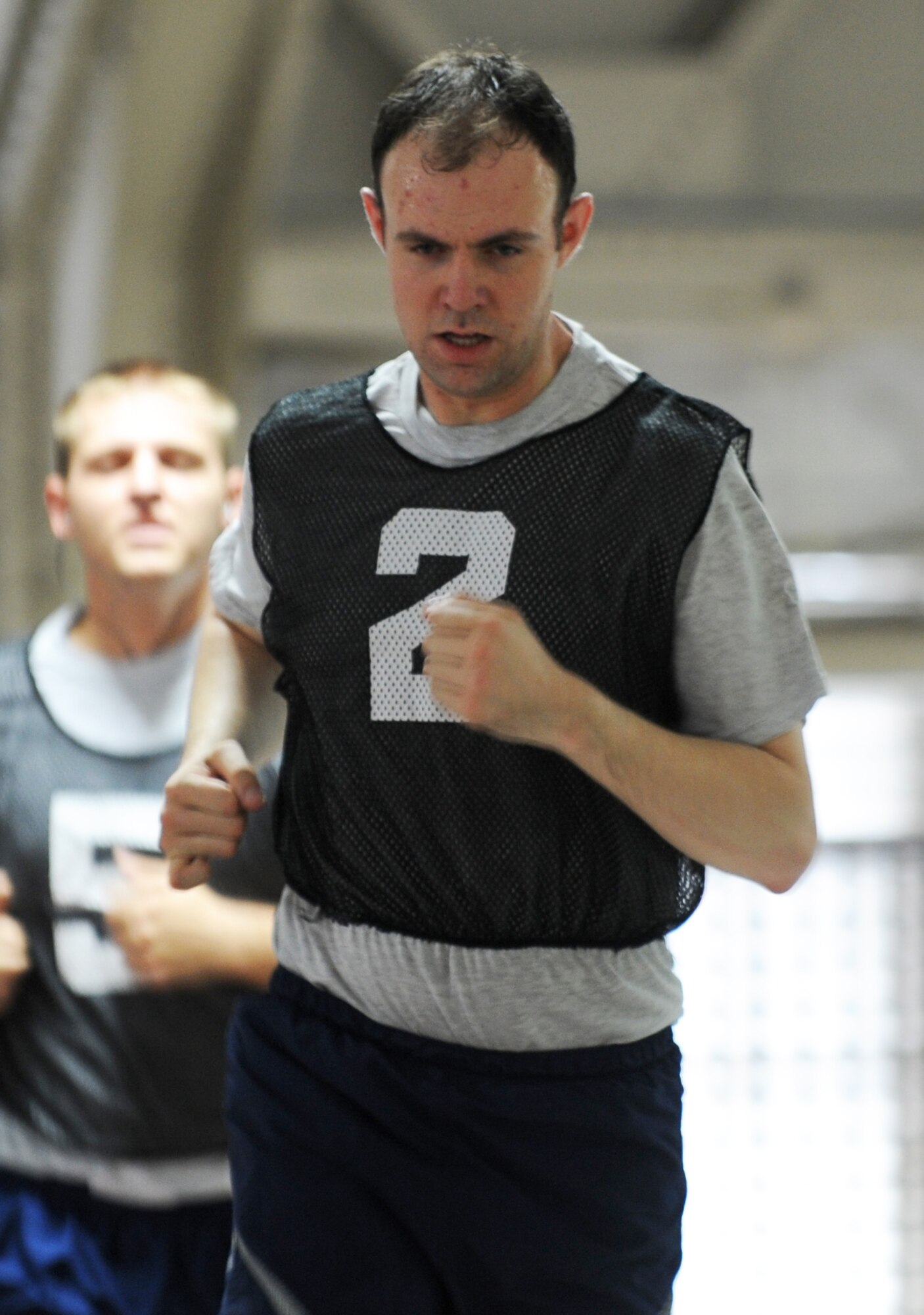 MISAWA AIR BASE, Japan -- Staff Sgt. Paul Kelley, 35th Force Support Squadron, runs his sixth lap on the Weasel's Den track during his physical training test Aug. 11.  When temperatures reach higher than 86 degrees in the summer or lower than 20 degrees in the winter, members of the 35th Fighter Wing run their PT tests on track at the Weasel's Den. (U.S. Air Force photo/ Staff Sgt. April Quintanilla)