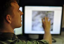 Senior Airman Zachary Kelly, a forecaster with the 51st Operations Support Squadron, explains some cloud formations June 30, 2011 over Osan Air Base. Forecaster's here provide timely and accurate tactical weather support relevant to the needs of the 51 Fighter Wing and tenant units in order to support continuous air operations. (U.S. Air Force photo/Tech. Sgt. Chad Thompson)