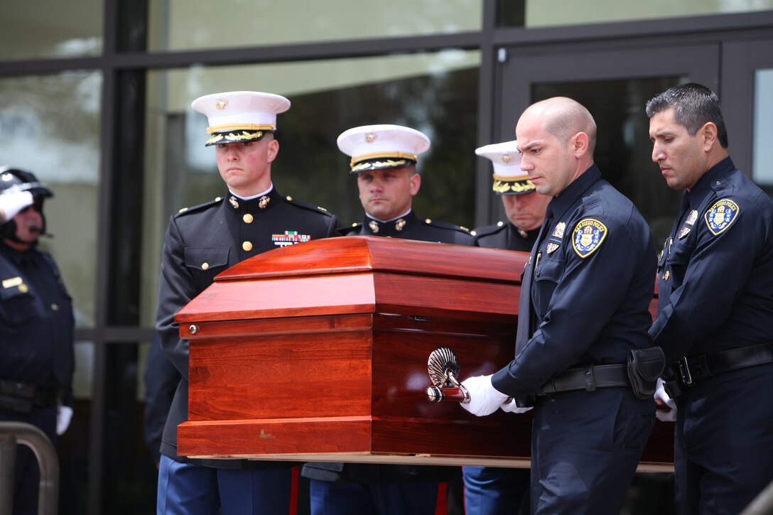 Marines and San Diego police officers escort the body of Officer Jeremy Henwood in San Diego, Aug. 12. Henwood, a Marine reserve officer, was posthumously promoted to the rank of major after being killed in the line of duty serving with the San Diego Police Department, Aug. 7.