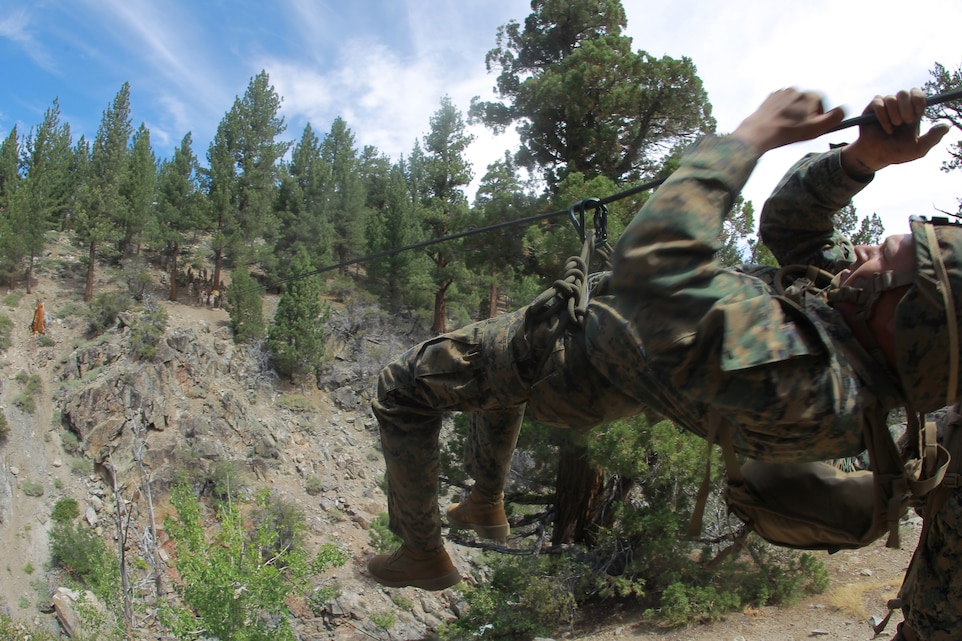 A Marine with Company B, 1st Battalion, 7th Marine Regiment, negotiates a gorge at the Marine Corps Mountain Warfare Training Center’s Leavitt Training Area Aug. 13, 2011, in Bridgeport, Calif. The Leavitt Training Area is where thousands of service members, both from U.S. services and allied militaries, have gained the skills to survive in the wild.