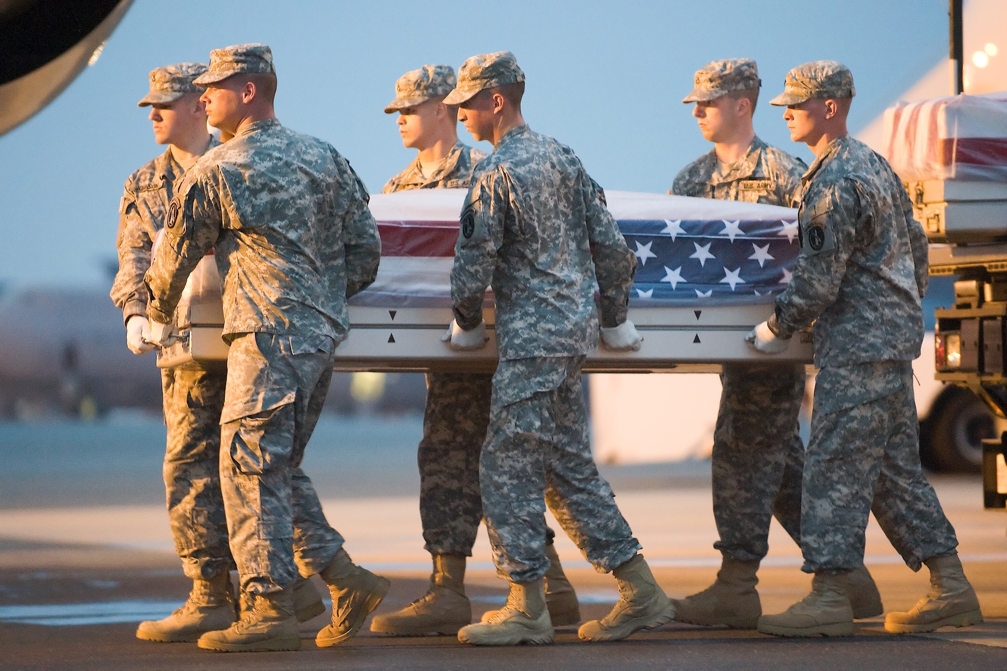 A U.S. Army carry team transfers the remains of Army Master Sgt. Charles L. Price III, of Milam, Texas, at Dover Air Force Base, Del., Aug. 13, 2011. Milam  was assigned to HHC, 2nd Battalion, 4th Infantry, Fort Carson, Col. (U.S. Air Force photo/Steve Kotecki)
