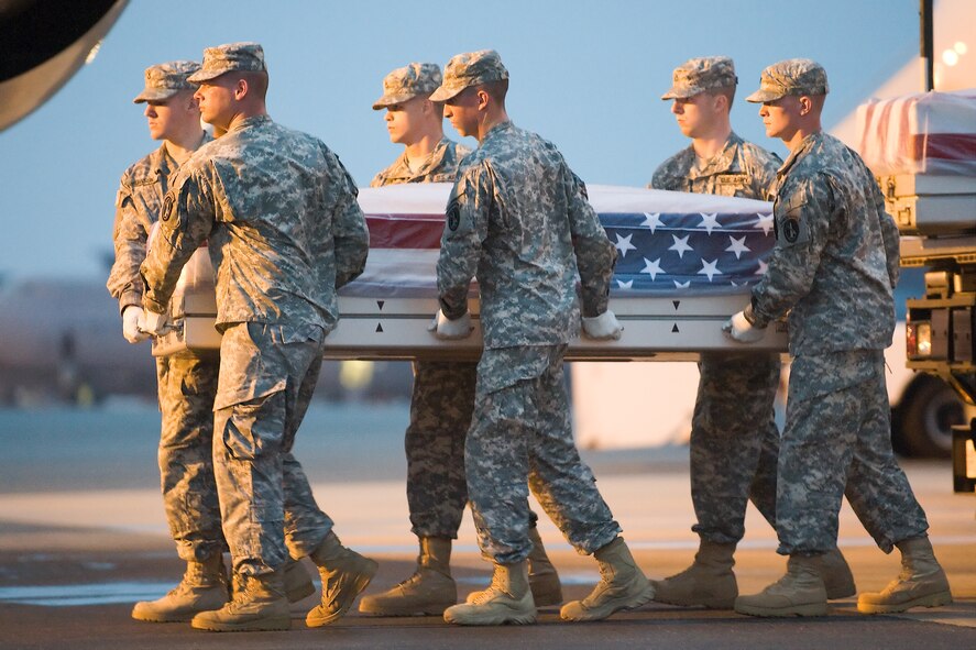 A U.S. Army carry team transfers the remains of Army Master Sgt. Charles L. Price III, of Milam, Texas, at Dover Air Force Base, Del., Aug. 13, 2011. Milam  was assigned to HHC, 2nd Battalion, 4th Infantry, Fort Carson, Col. (U.S. Air Force photo/Steve Kotecki)
