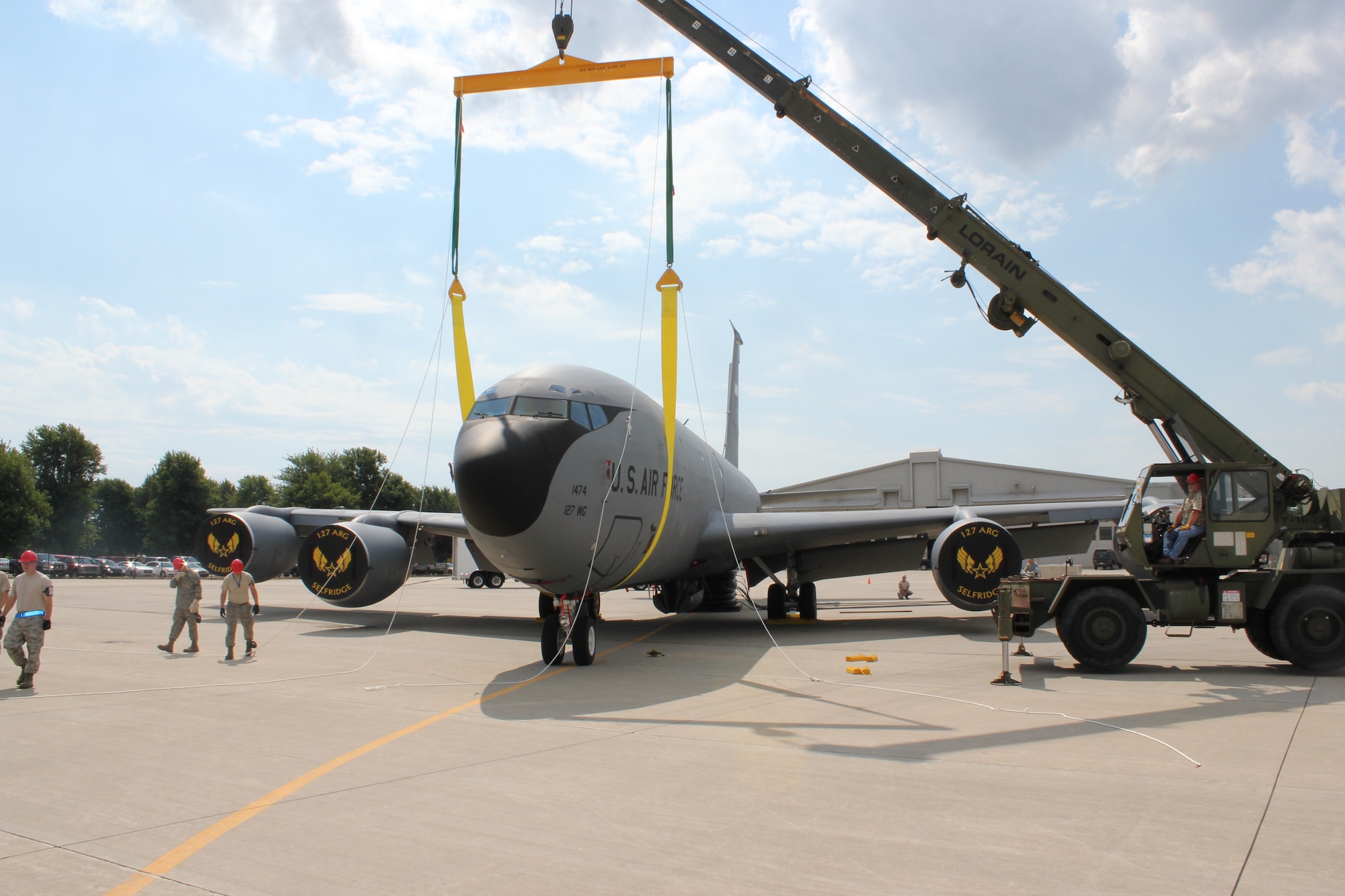 Airmen from the 191st Maintenance Squadron, prepare to lift the nose of a KC-135 Stratotanker during a training exercise at Selfridge Air National Guard Base, Mich., Aug. 13, 2011. The 191st MXS performed an exercise in which they simulated a KC-135 had damaged nose gear and a crane was needed to move the aircraft to a safe location for repair. (USAF photo by TSgt. Dan Heaton)