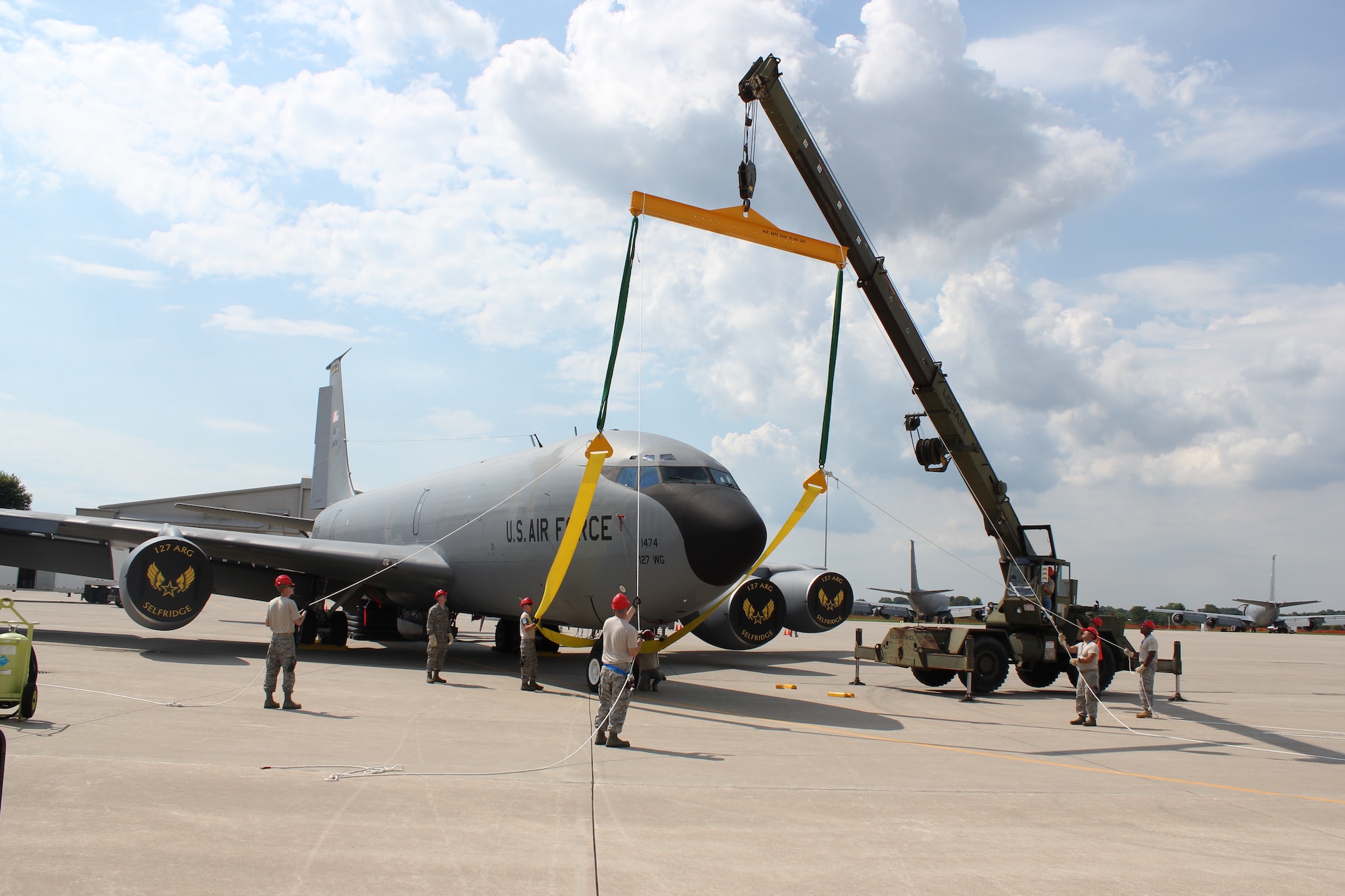 Airmen from the 191st Maintenance Squadron, prepare to lift the nose of a KC-135 Stratotanker during a training exercise at Selfridge Air National Guard Base, Mich., Aug. 13, 2011. The 191st MXS performed an exercise in which they simulated a KC-135 had damaged nose gear and a crane was needed to move the aircraft to a safe location for repair. (USAF photo by TSgt. Dan Heaton)