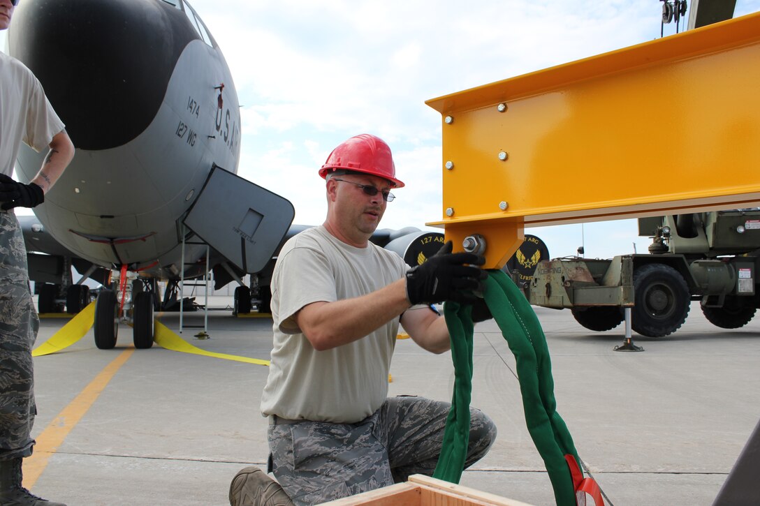 TSgt. Dave Thomas, 191st Maintenance Squadron, prepares a sling to be used during a training exercise at Selfridge Air National Guard Base, Mich., Aug. 13, 2011. The 191st MXS performed an exercise in which they simulated a KC-135 Stratotanker had damaged nose gear and a crane was needed to move the aircraft to a safe location for repair. (USAF photo by TSgt. Dan Heaton)