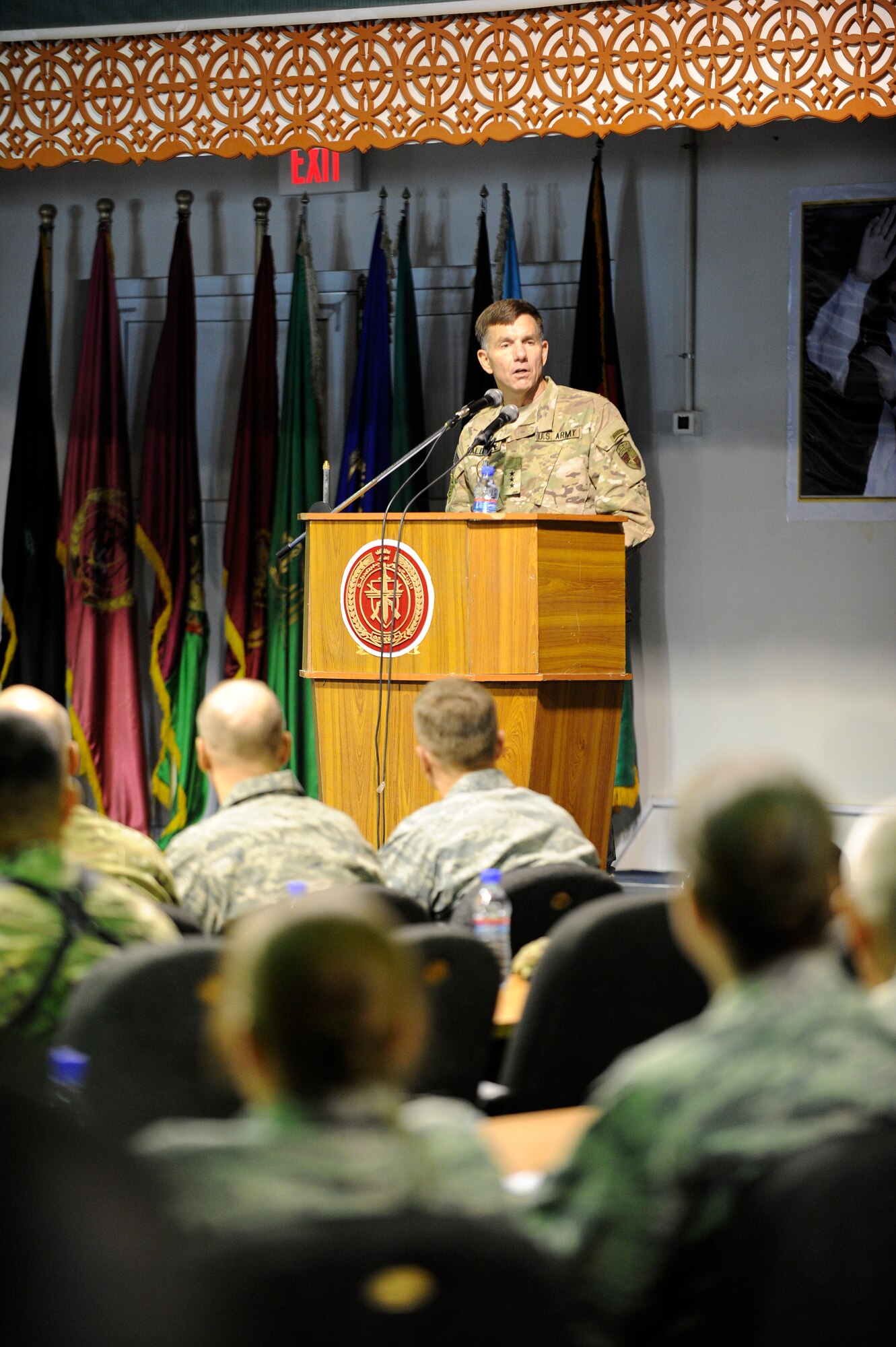 U.S. Army Lt. Gen. William Caldwell, NATO Training Mission – Afghanistan commander, speaks to service members during an awards ceremony at Kabul International Airport, Kabul, Afghanistan, August 13, 2011. Five members of the wing were awarded medals at the presentation ceremony with Master Sgt. Christopher Banks, a ground medic, earning the Bronze Star with Valor for his actions in the line of fire April 27, 2011. (U.S. Air Force Photo by Staff Sergeant Matthew Smith)
