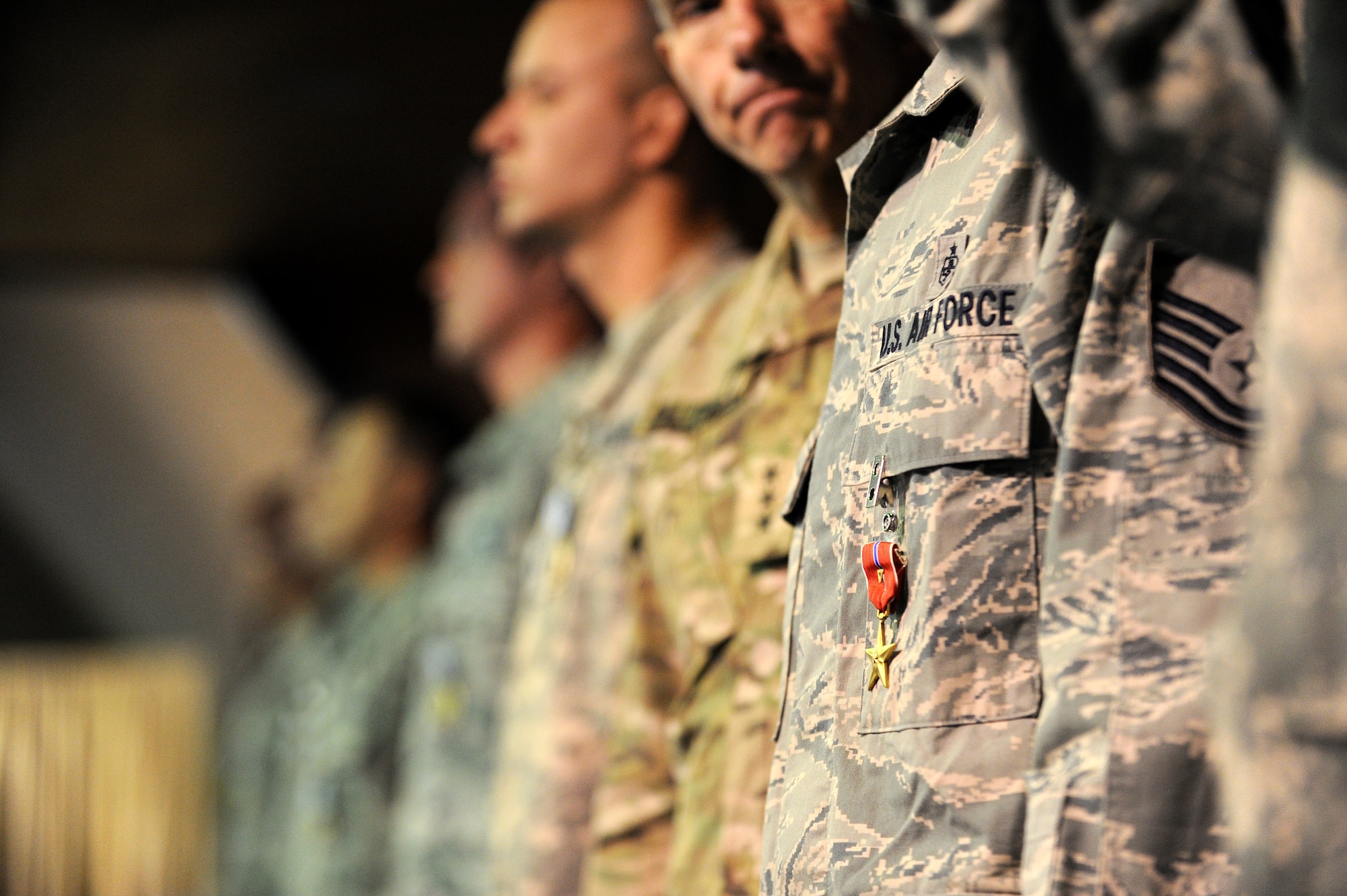 The Bronze Star with Valor is displayed upon the chest of U.S. Air Force Master Sgt. Christopher Banks, a ground medic with the 438th Air Expeditionary Wing, after being awarded the medal for his actions taken in the line of fire April 27, 2011. (U.S. Air Force photo by Staff Sergeant Matthew Smith)
