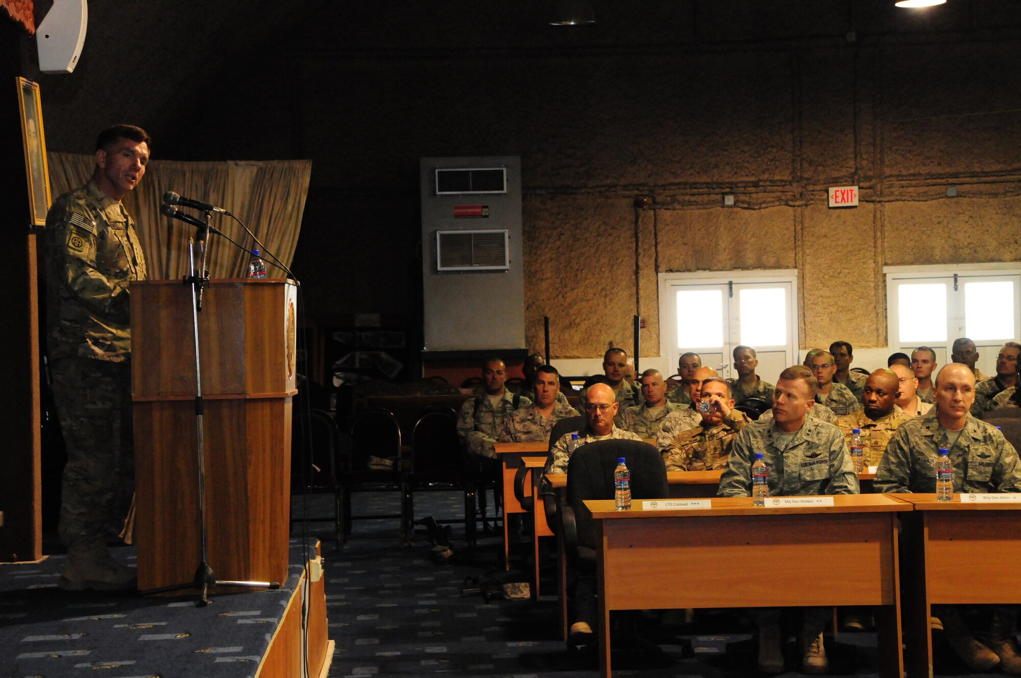 U.S. Army Lt. Gen. William Caldwell, NATO Training Mission – Afghanistan commander, speaks to service members during an awards ceremony at Kabul International Airport, Kabul, Afghanistan, August 13, 2011. Five members of the wing were awarded medals at the presentation ceremony with Master Sgt. Christopher Banks, a ground medic, earning the Bronze Star with Valor for his actions in the line of fire April 27, 2011. (U.S. Air Force photo by Senior Airman Amber Williams)