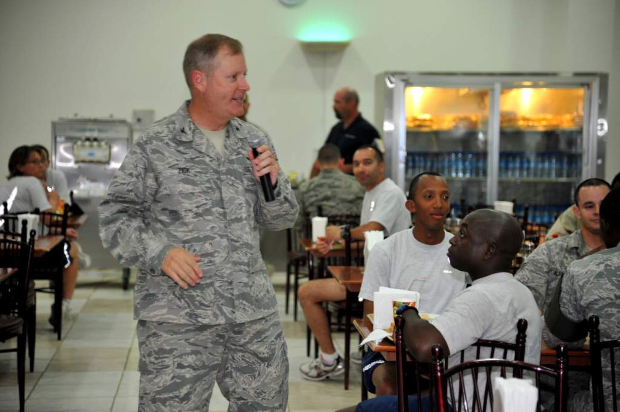 Col Michael Zick, 386th AEW commander, addresses the lunch-time crowd during a quick ceremony to commemorate the redesignation of the 386th from a group to a wing.  (U.S. Air Force photo by MSgt Carlotta Holley)