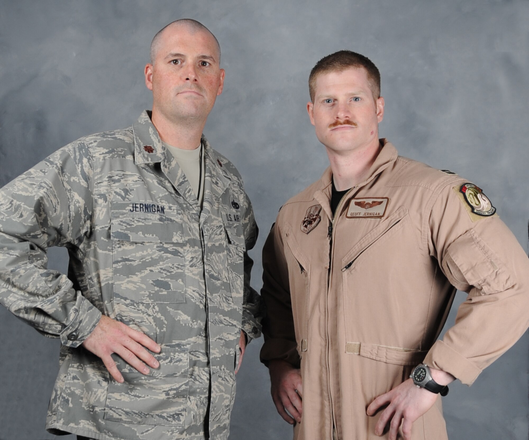 Brothers Maj. James Jernigan, commander of the 380th Expeditionary Maintenance Squadron, and Capt. Geoffrey Jernigan, a pilot with the  380th Expeditonary Operations Group, pose for a photo during their deployment together in Southwest Asia. (U.S. Air Force photo/Tech Sgt. Patrick Mitchell) 