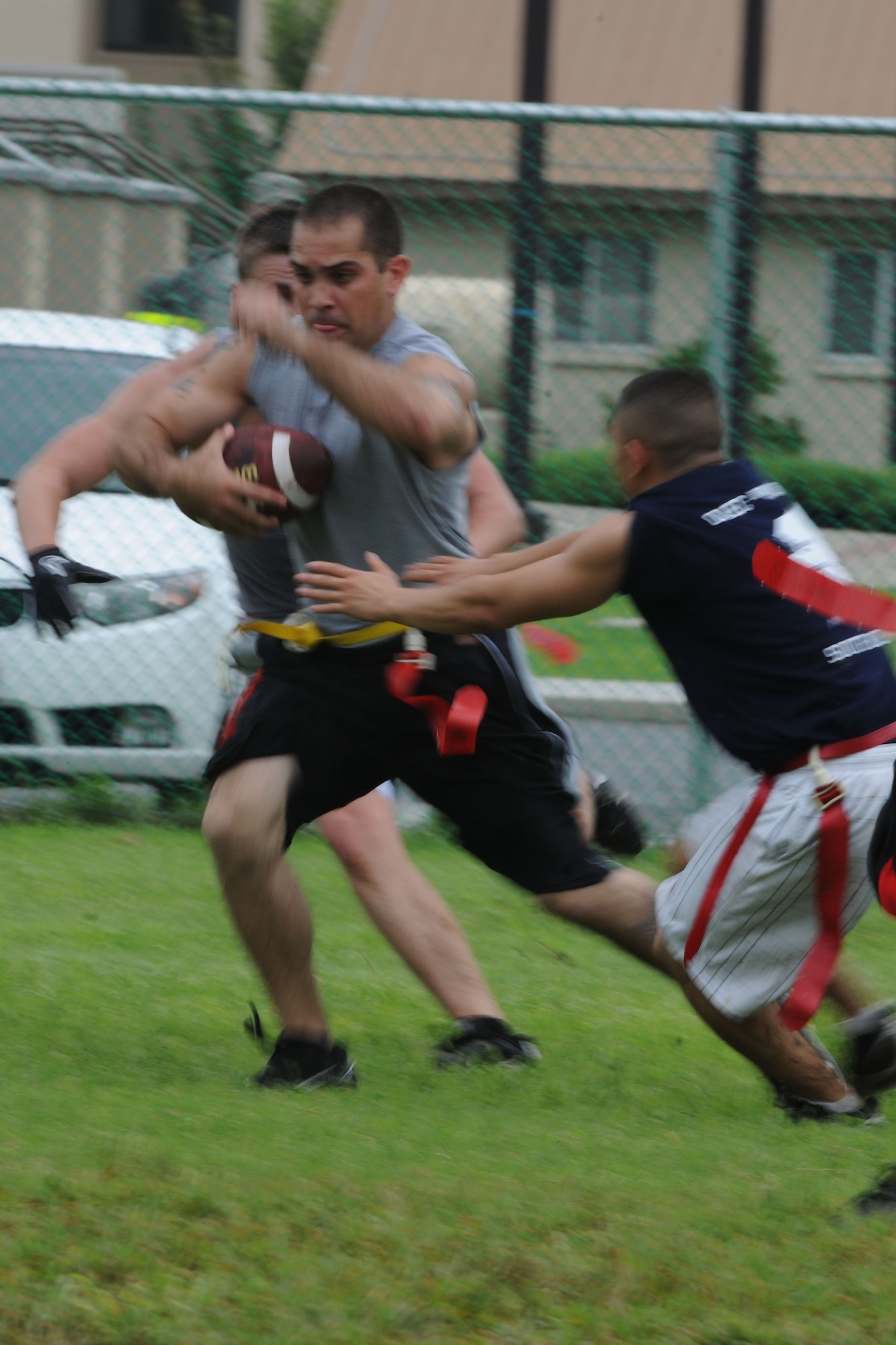 KUNSAN AIR BASE, Republic of Korea -- Airmen participate in a game of flag football during the Kunsan vs Osan sports day here Aug. 12. Airmen from both bases competed in different sports including bowling, basketball, volleyball and dodgeball. (U.S. Air Force photo/Senior Airman Brittany Y. Bateman)